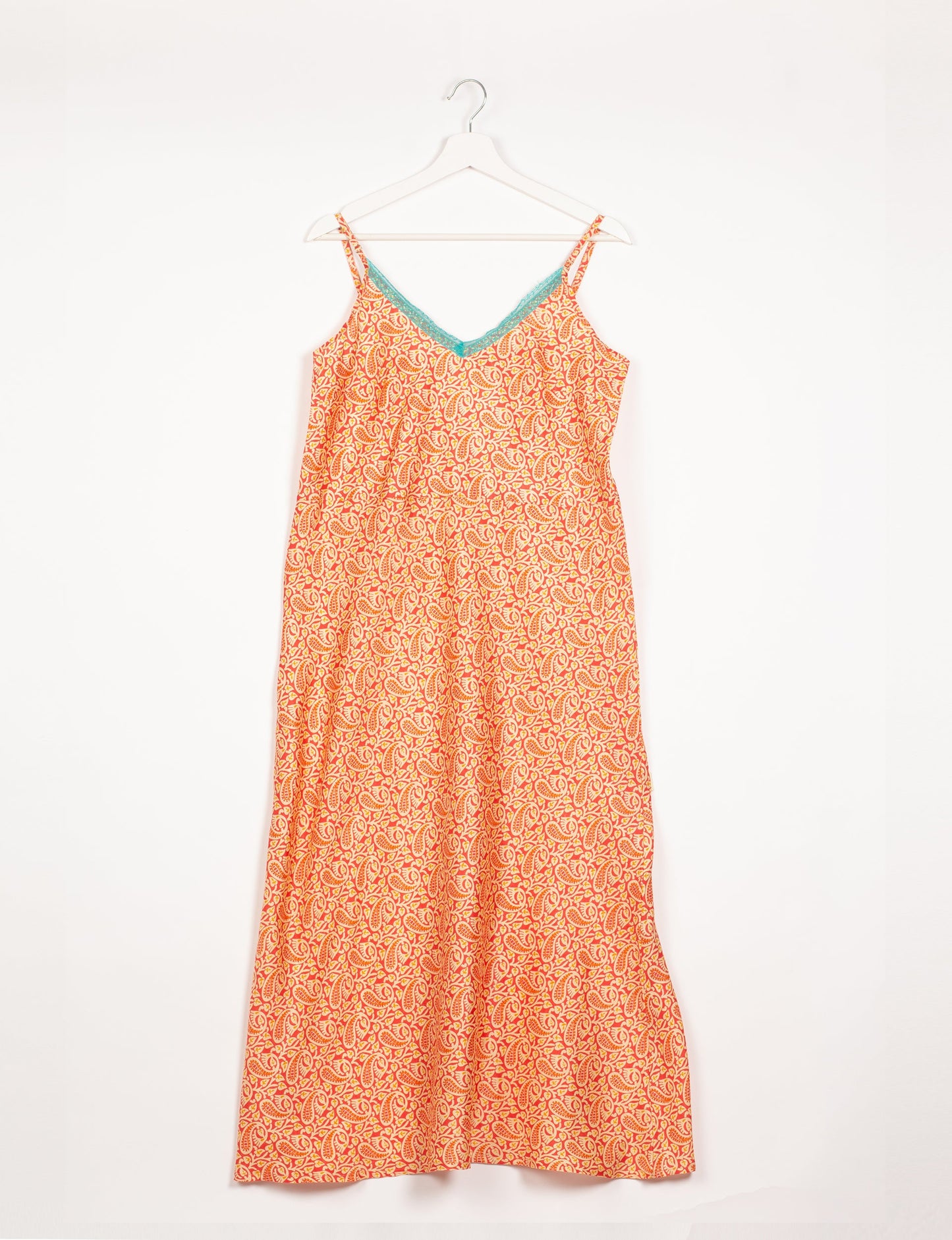 Spaghetti strap dress made from sustainable materials, embodying ethical fashion principles. Ideal for eco-friendly travelers seeking laid-back style.