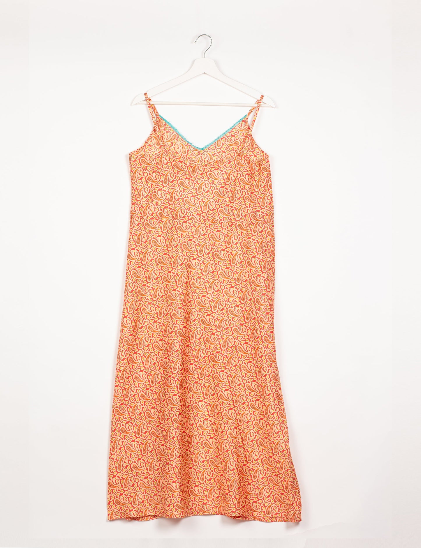 Spaghetti strap dress made from sustainable materials, embodying ethical fashion principles. Ideal for eco-friendly travelers seeking laid-back style.