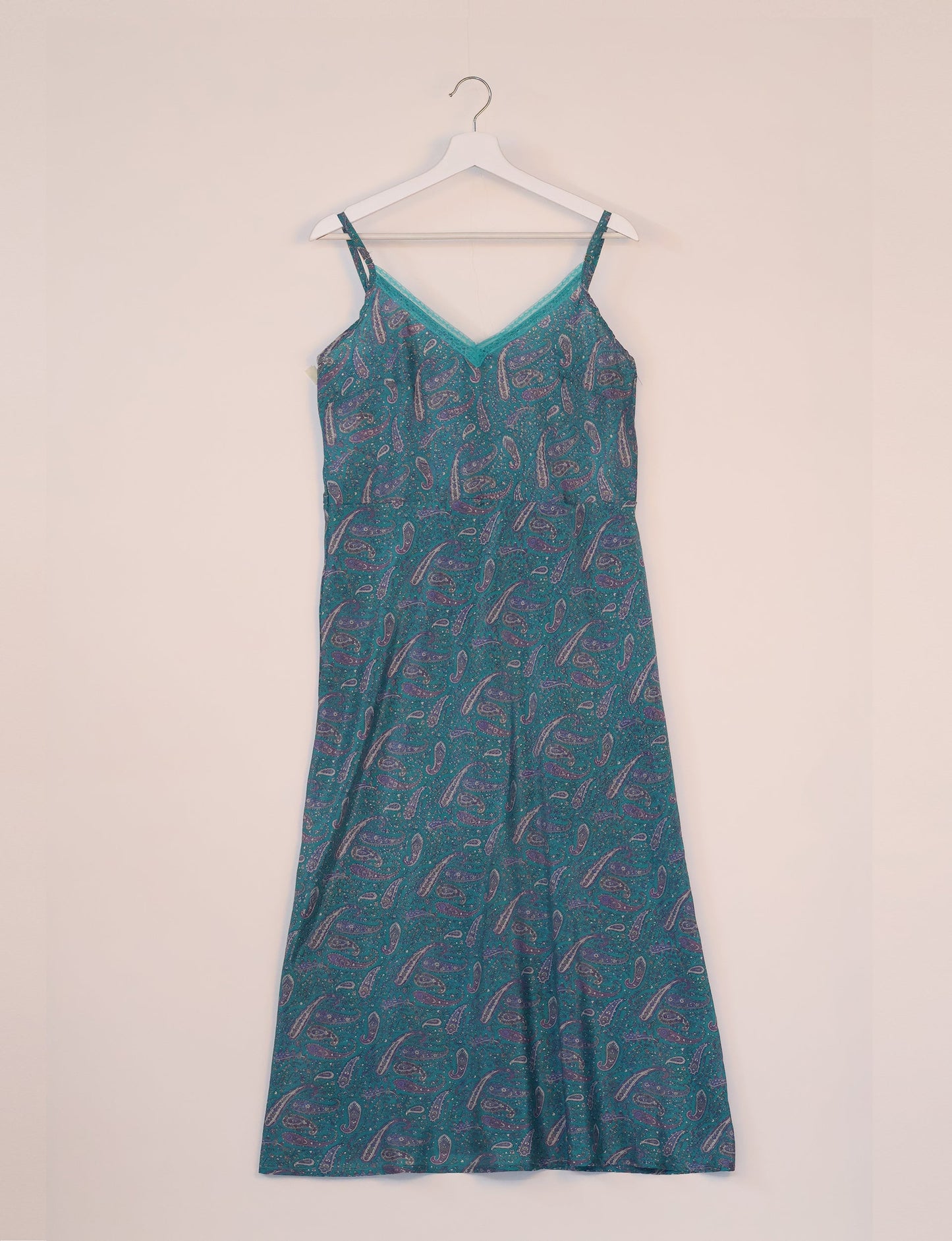 Spaghetti strap dress made from sustainable materials, embodying ethical fashion principles. Ideal for eco-friendly travelers seeking laid-back style.