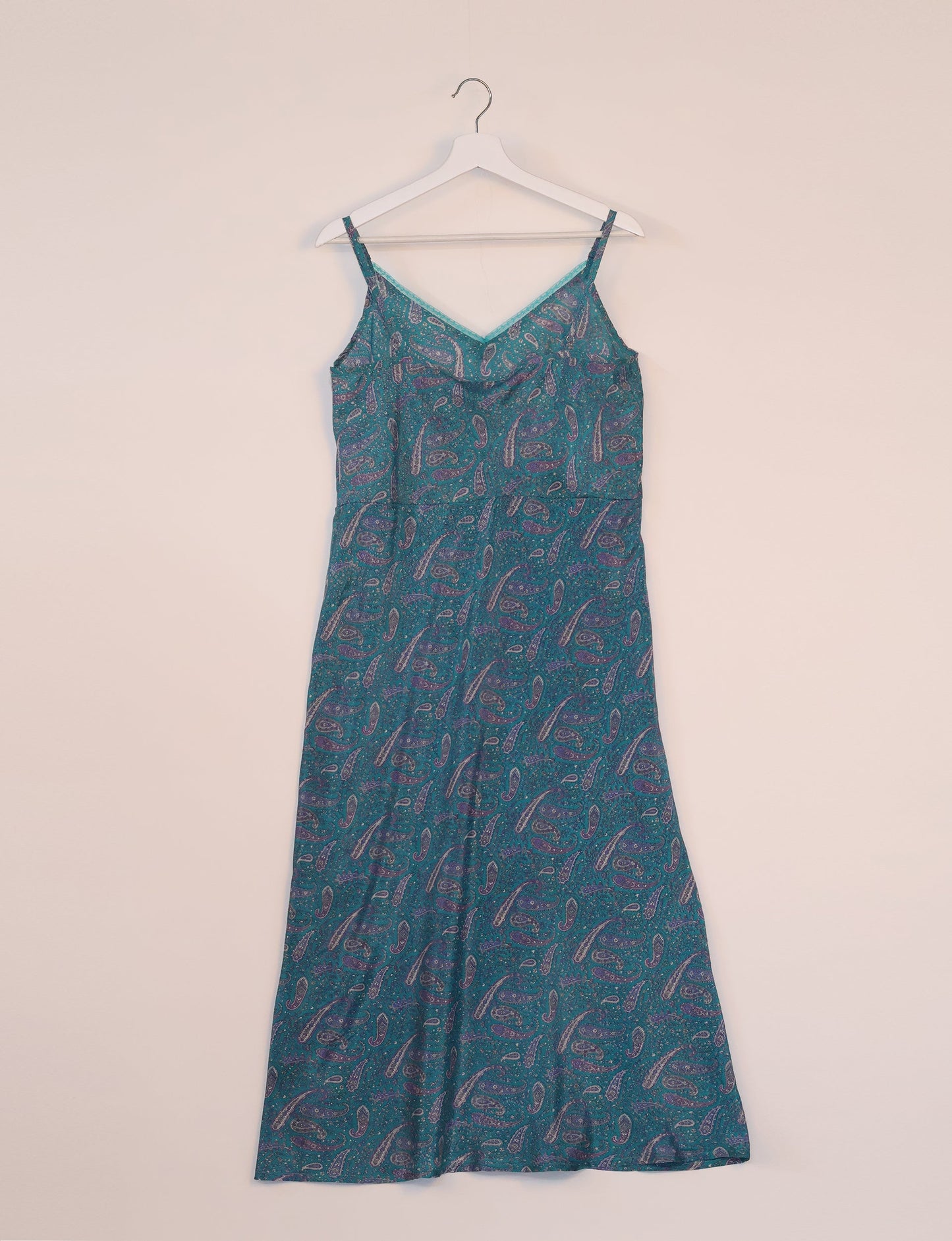 Spaghetti strap dress made from sustainable materials, embodying ethical fashion principles. Ideal for eco-friendly travelers seeking laid-back style.