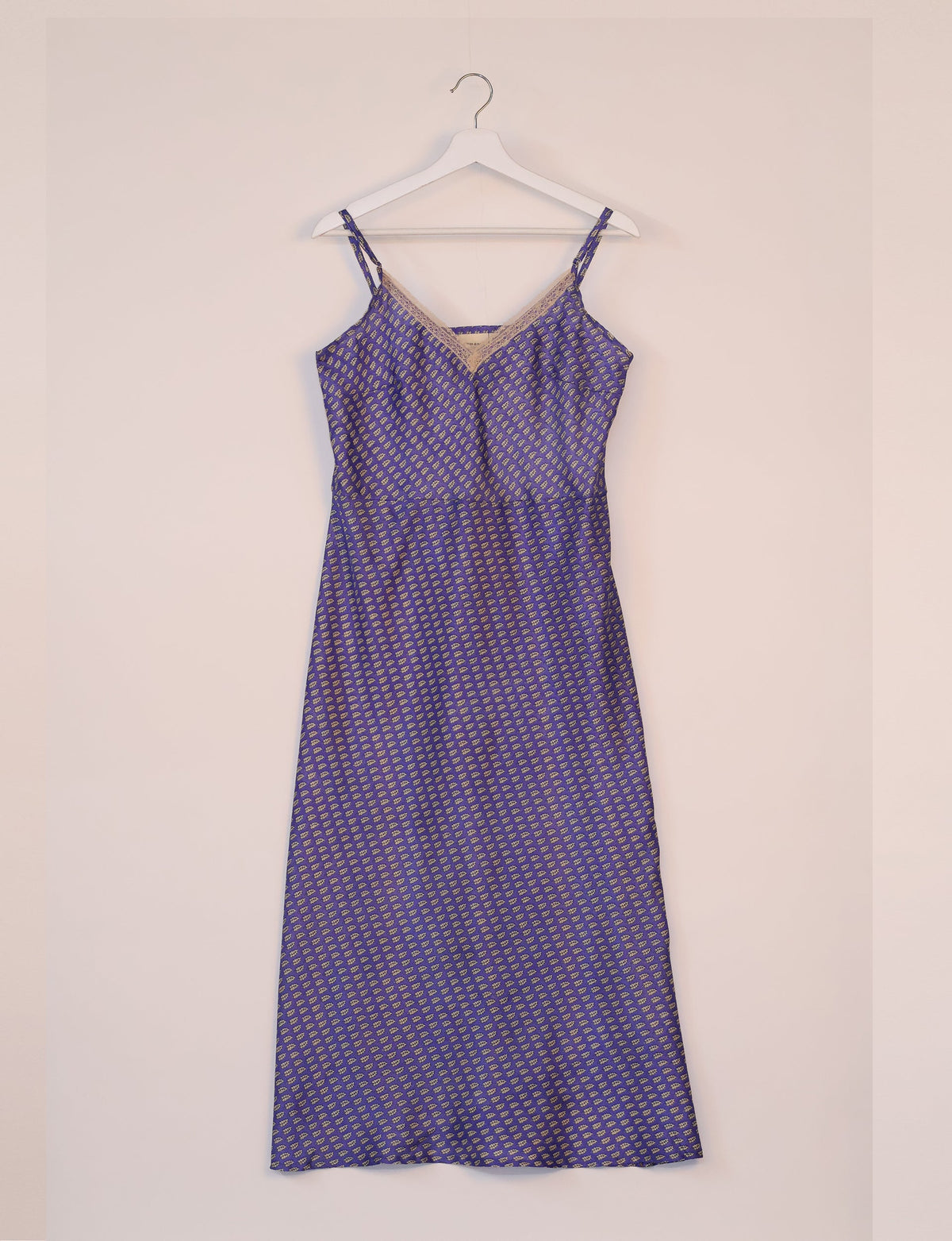 Spaghetti strap dress made from sustainable materials, embodying ethical fashion principles. Ideal for eco-friendly travelers seeking laid-back style.