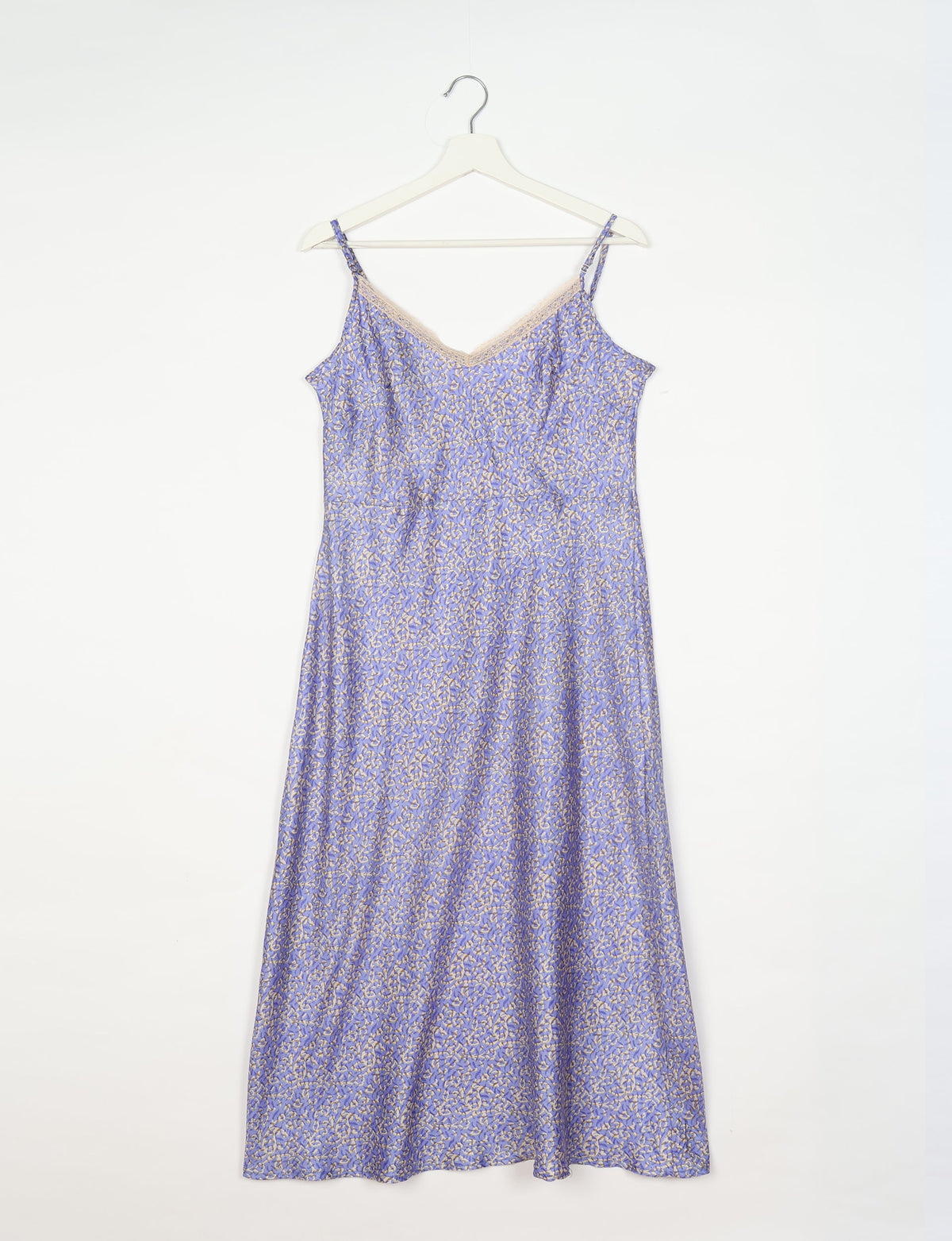 Spaghetti strap dress made from sustainable materials, embodying ethical fashion principles. Ideal for eco-friendly travelers seeking laid-back style.