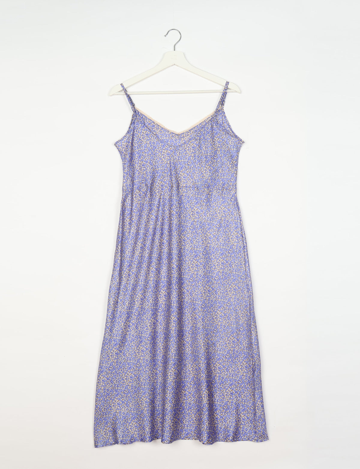 Spaghetti strap dress made from sustainable materials, embodying ethical fashion principles. Ideal for eco-friendly travelers seeking laid-back style.