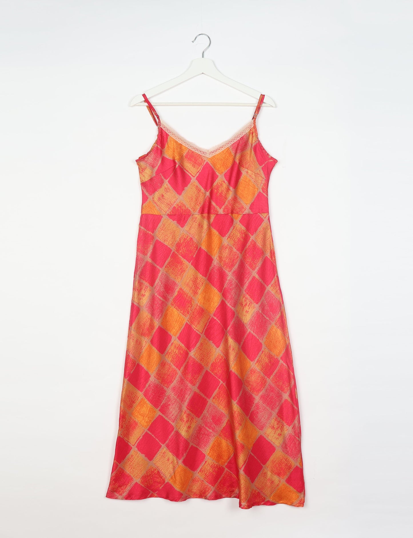 Spaghetti strap dress made from sustainable materials, embodying ethical fashion principles. Ideal for eco-friendly travelers seeking laid-back style.