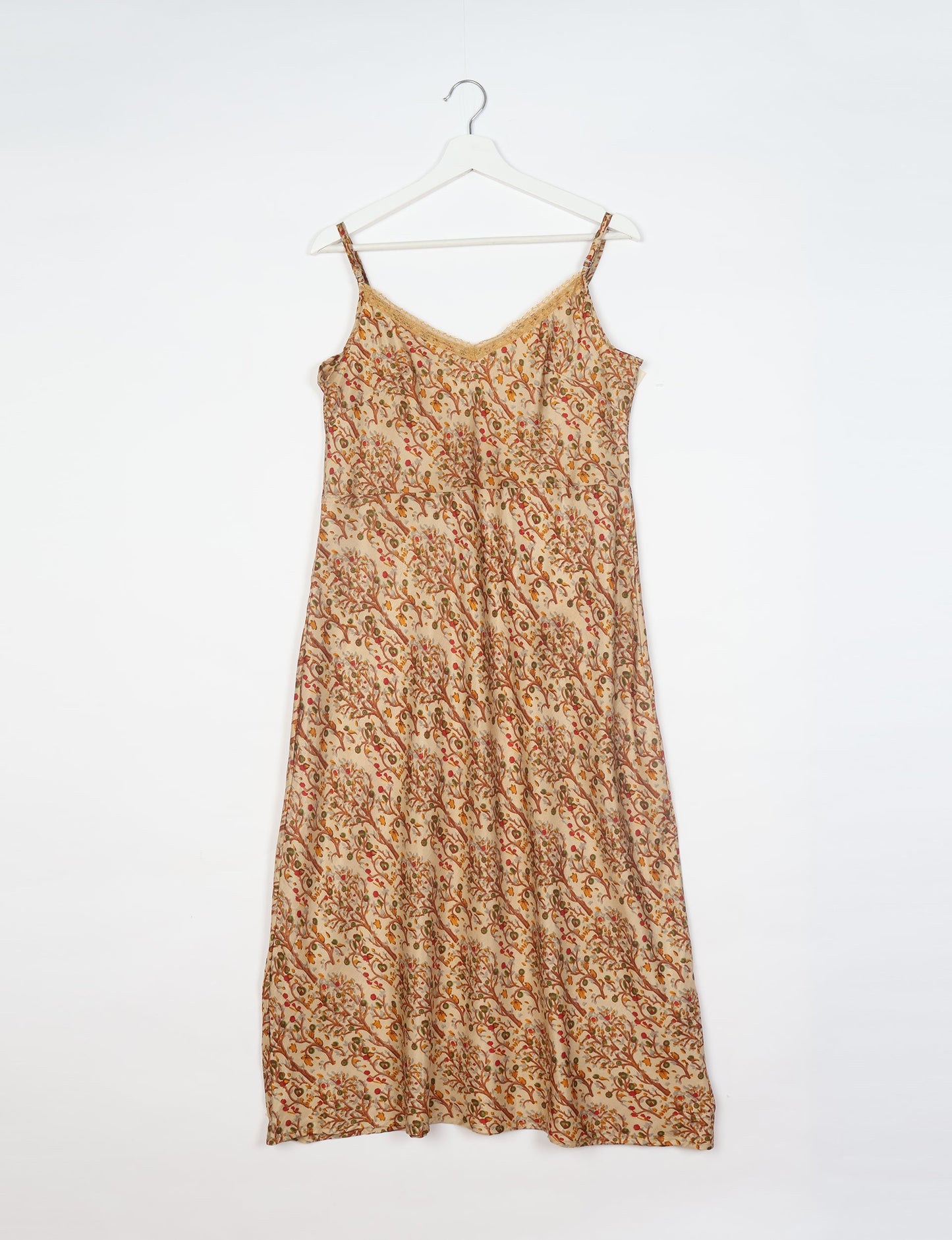 Spaghetti strap dress made from sustainable materials, embodying ethical fashion principles. Ideal for eco-friendly travelers seeking laid-back style.