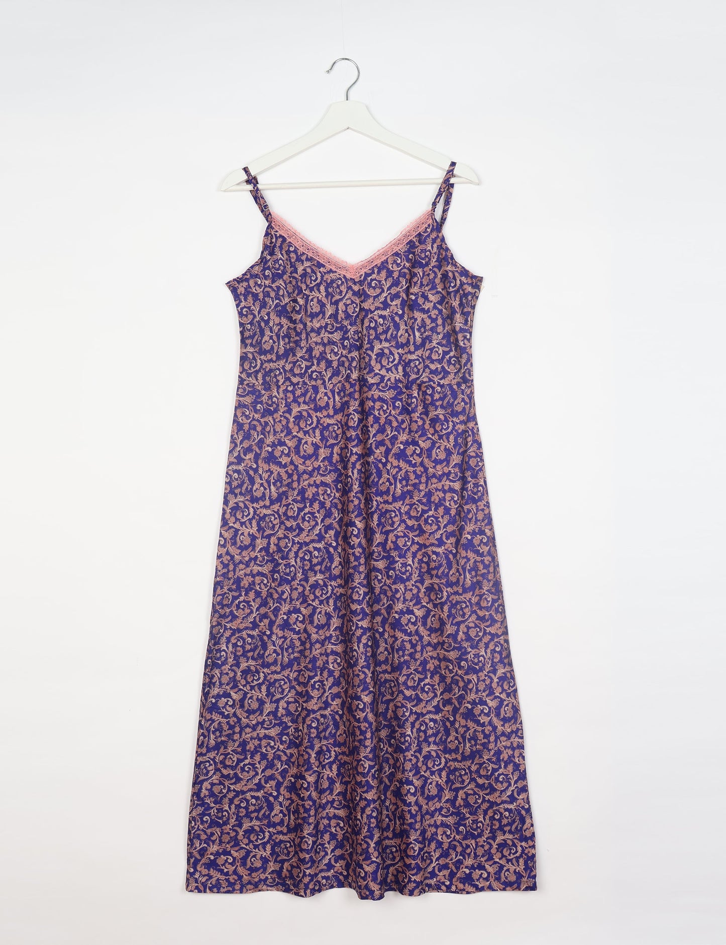 Spaghetti strap dress made from sustainable materials, embodying ethical fashion principles. Ideal for eco-friendly travelers seeking laid-back style.