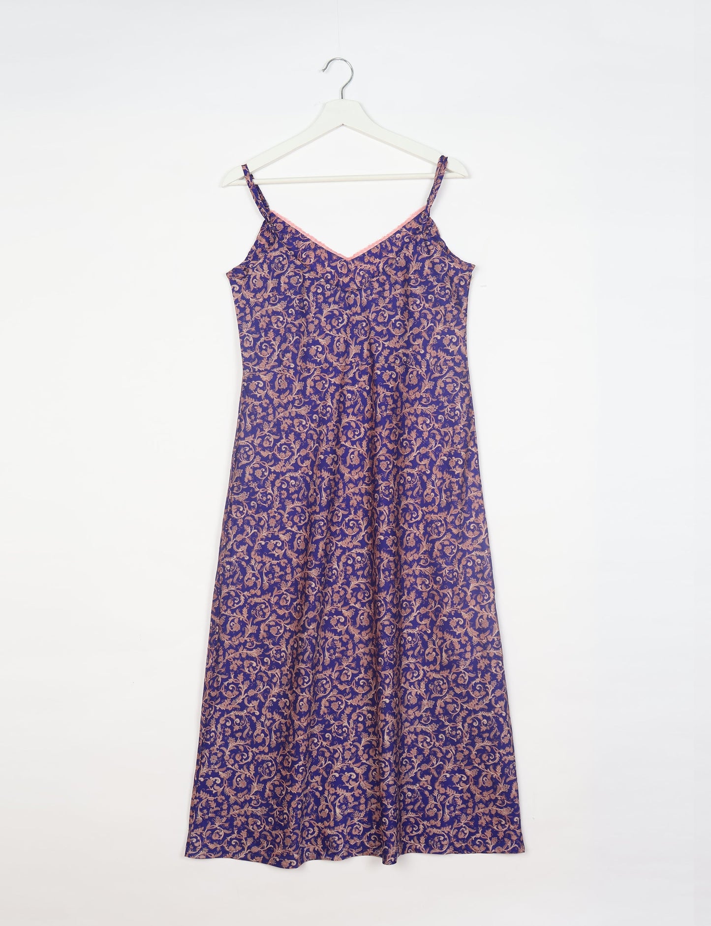 Spaghetti strap dress made from sustainable materials, embodying ethical fashion principles. Ideal for eco-friendly travelers seeking laid-back style.