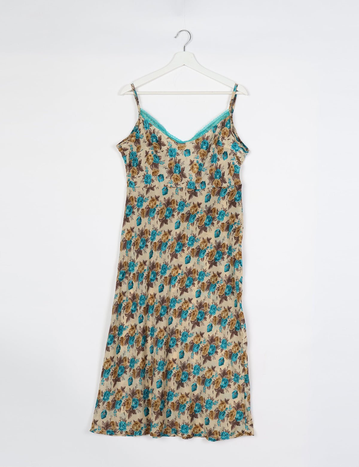 Spaghetti strap dress made from sustainable materials, embodying ethical fashion principles. Ideal for eco-friendly travelers seeking laid-back style.