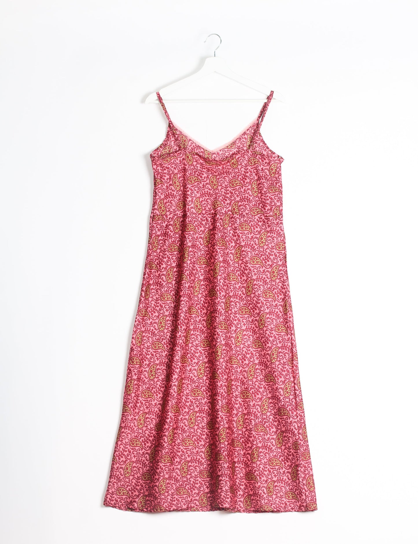 Spaghetti strap dress made from sustainable materials, embodying ethical fashion principles. Ideal for eco-friendly travelers seeking laid-back style.