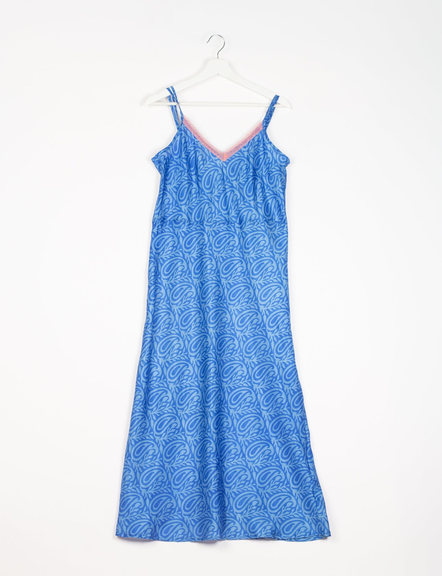 Spaghetti strap dress made from sustainable materials, embodying ethical fashion principles. Ideal for eco-friendly travelers seeking laid-back style.