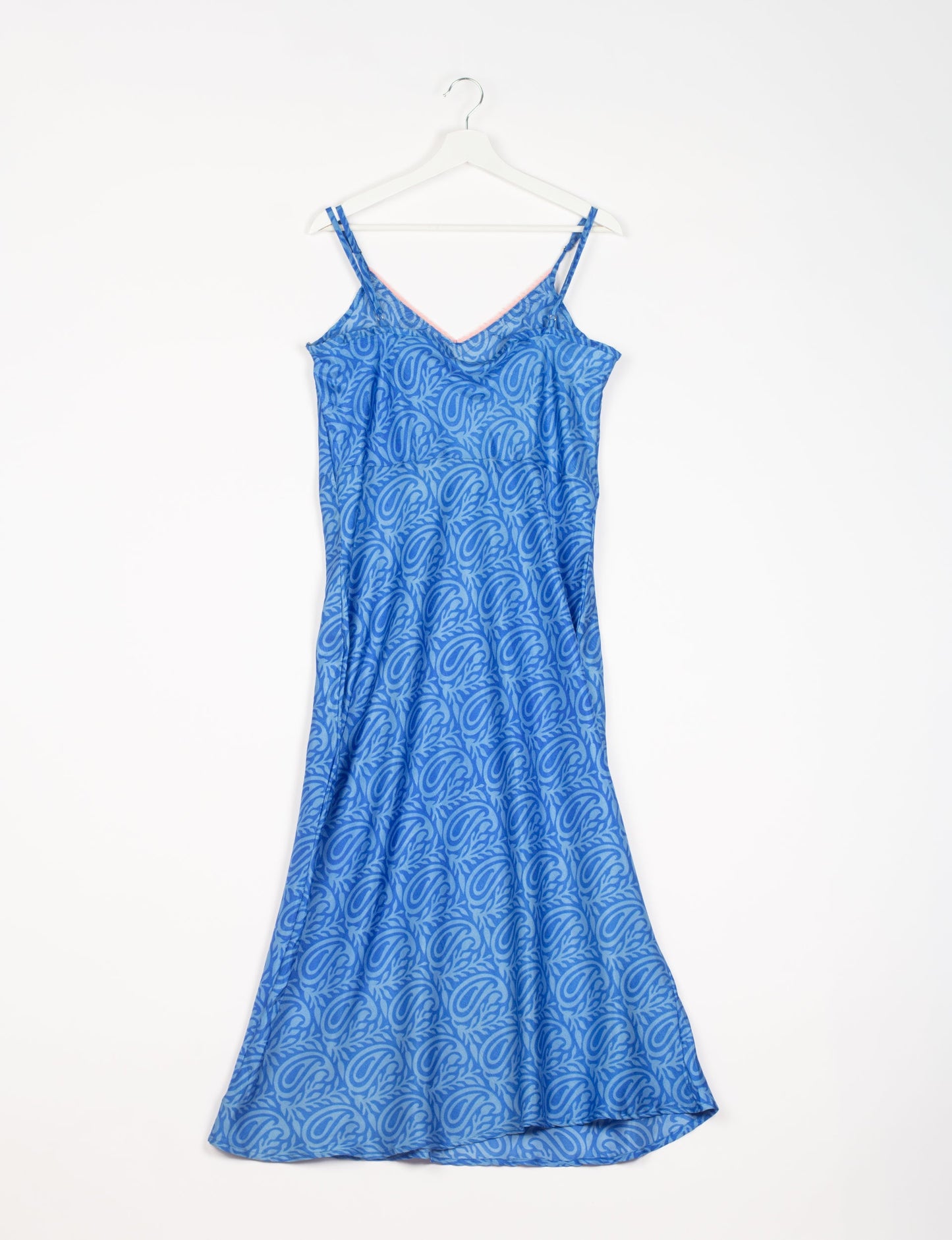 Spaghetti strap dress made from sustainable materials, embodying ethical fashion principles. Ideal for eco-friendly travelers seeking laid-back style.