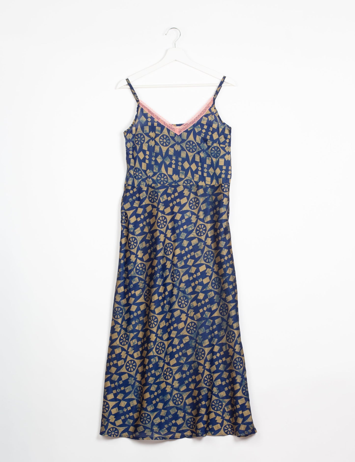 Spaghetti strap dress made from sustainable materials, embodying ethical fashion principles. Ideal for eco-friendly travelers seeking laid-back style.