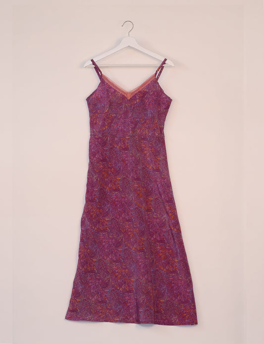 Spaghetti strap dress made from sustainable materials, embodying ethical fashion principles. Ideal for eco-friendly travelers seeking laid-back style.