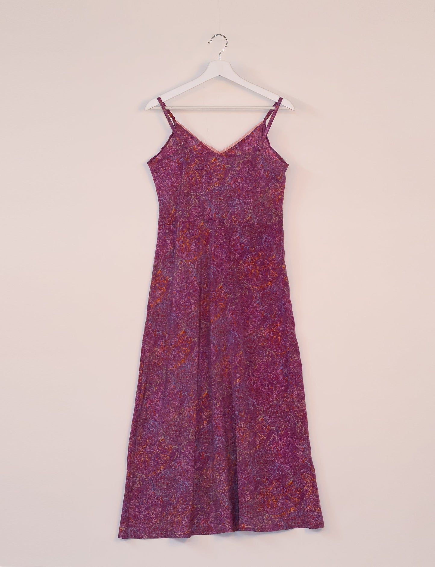 Spaghetti strap dress made from sustainable materials, embodying ethical fashion principles. Ideal for eco-friendly travelers seeking laid-back style.