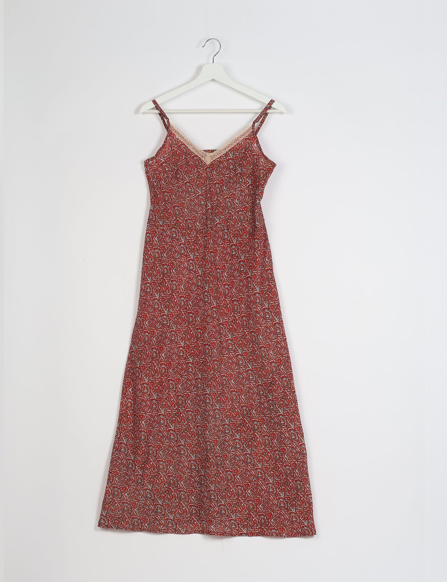 Spaghetti strap dress made from sustainable materials, embodying ethical fashion principles. Ideal for eco-friendly travelers seeking laid-back style.