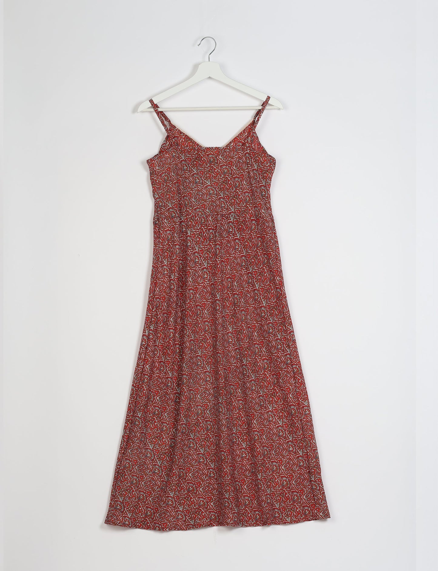 Spaghetti strap dress made from sustainable materials, embodying ethical fashion principles. Ideal for eco-friendly travelers seeking laid-back style.