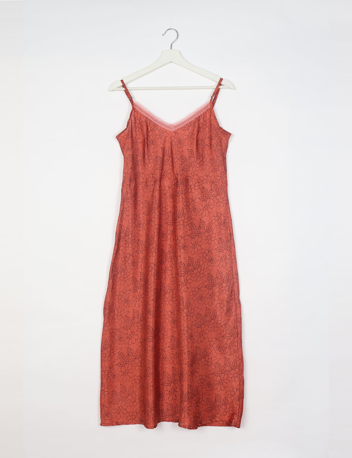Spaghetti strap dress made from sustainable materials, embodying ethical fashion principles. Ideal for eco-friendly travelers seeking laid-back style.