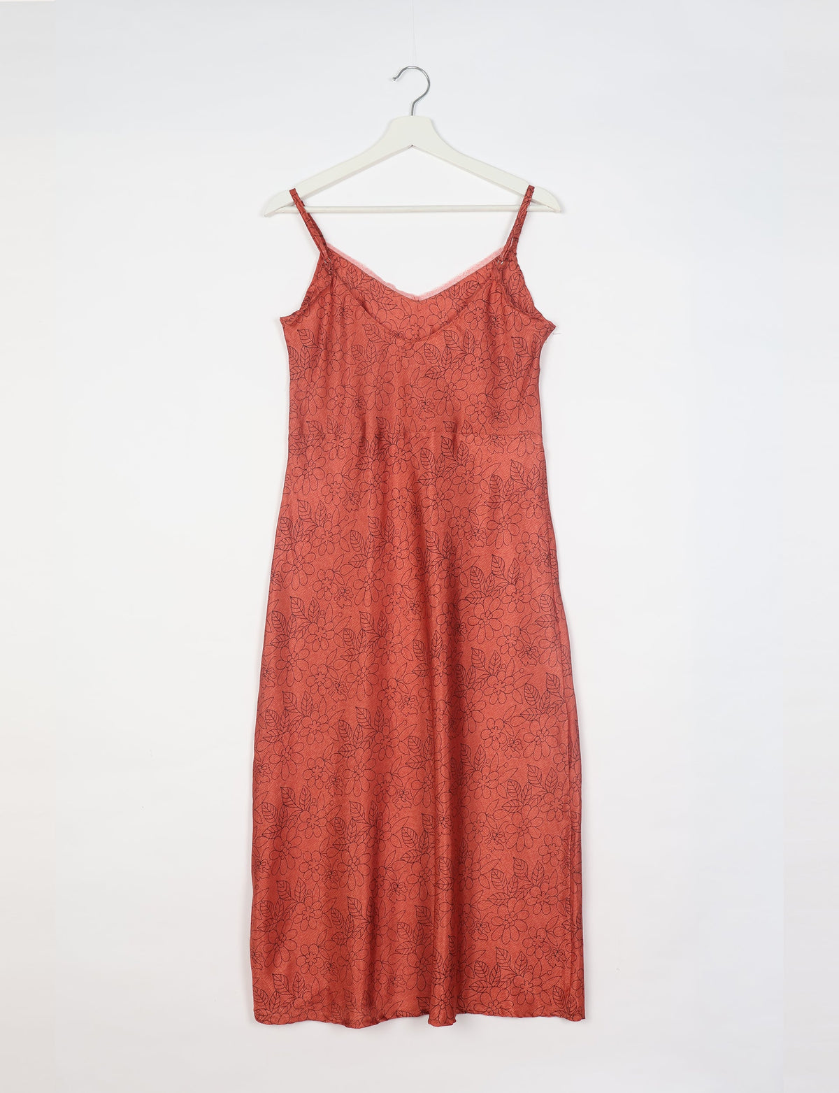 Spaghetti strap dress made from sustainable materials, embodying ethical fashion principles. Ideal for eco-friendly travelers seeking laid-back style.