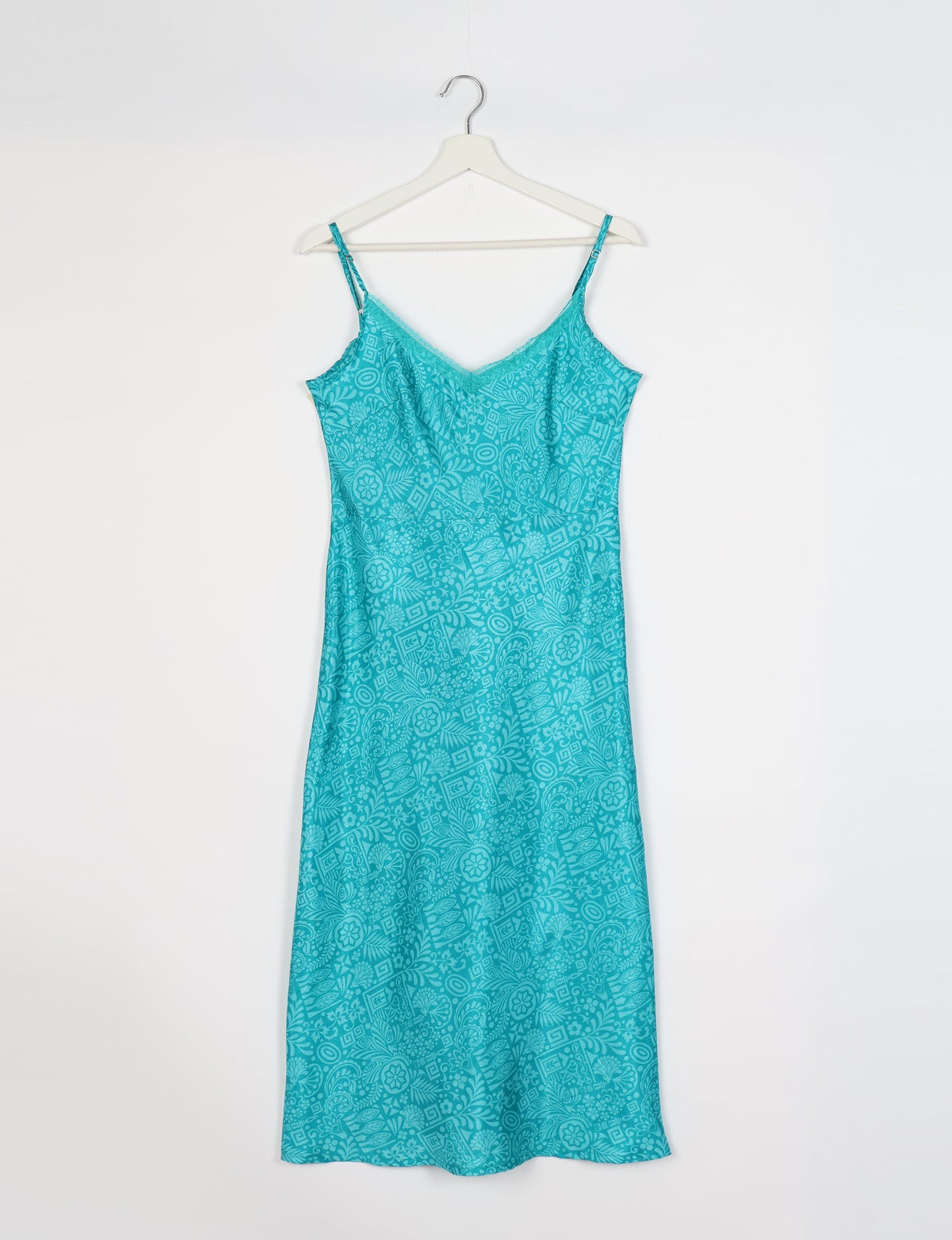Spaghetti strap dress made from sustainable materials, embodying ethical fashion principles. Ideal for eco-friendly travelers seeking laid-back style.