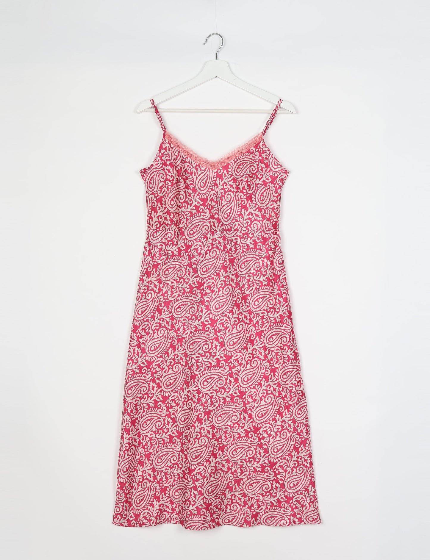 Spaghetti strap dress made from sustainable materials, embodying ethical fashion principles. Ideal for eco-friendly travelers seeking laid-back style.