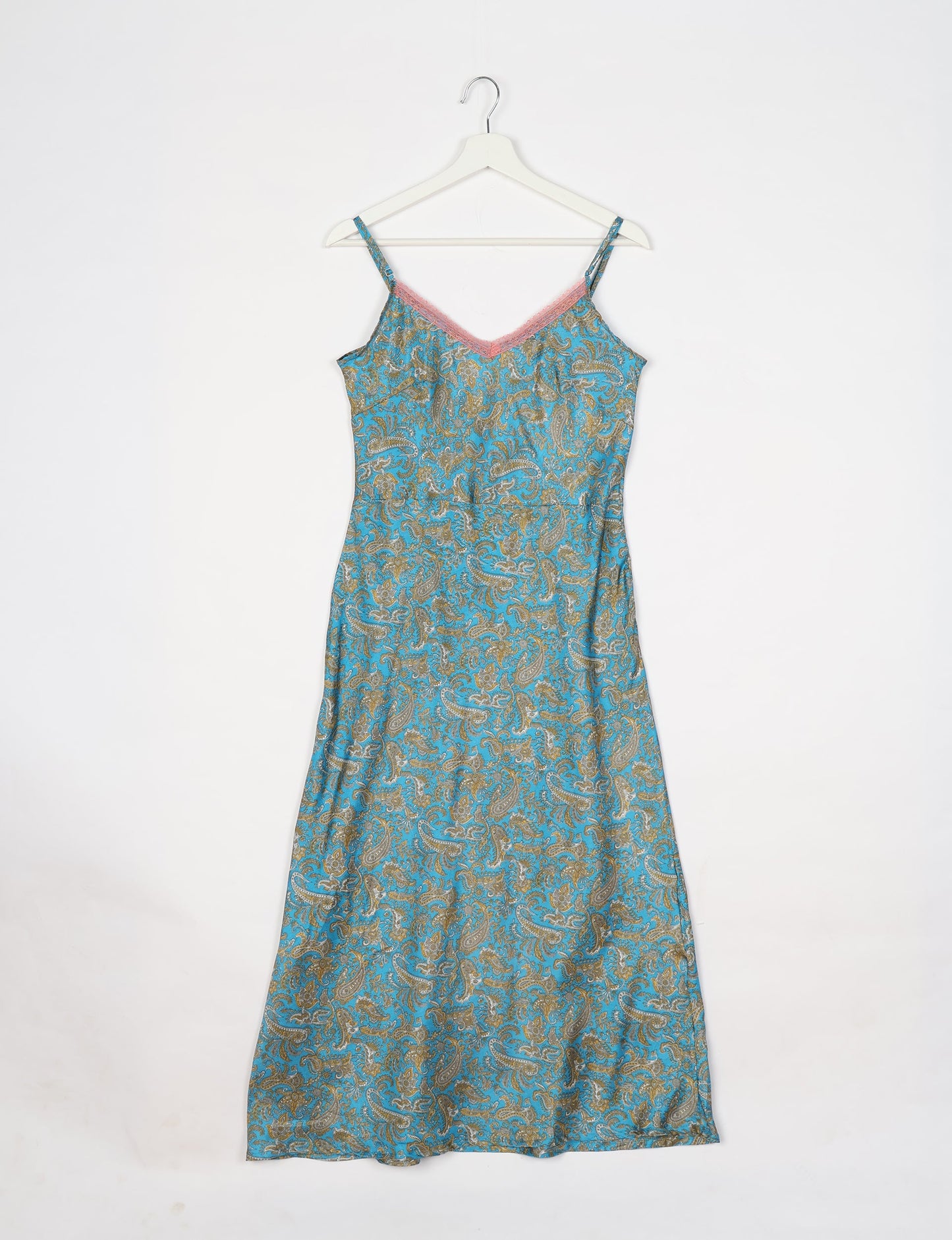 Spaghetti strap dress made from sustainable materials, embodying ethical fashion principles. Ideal for eco-friendly travelers seeking laid-back style.