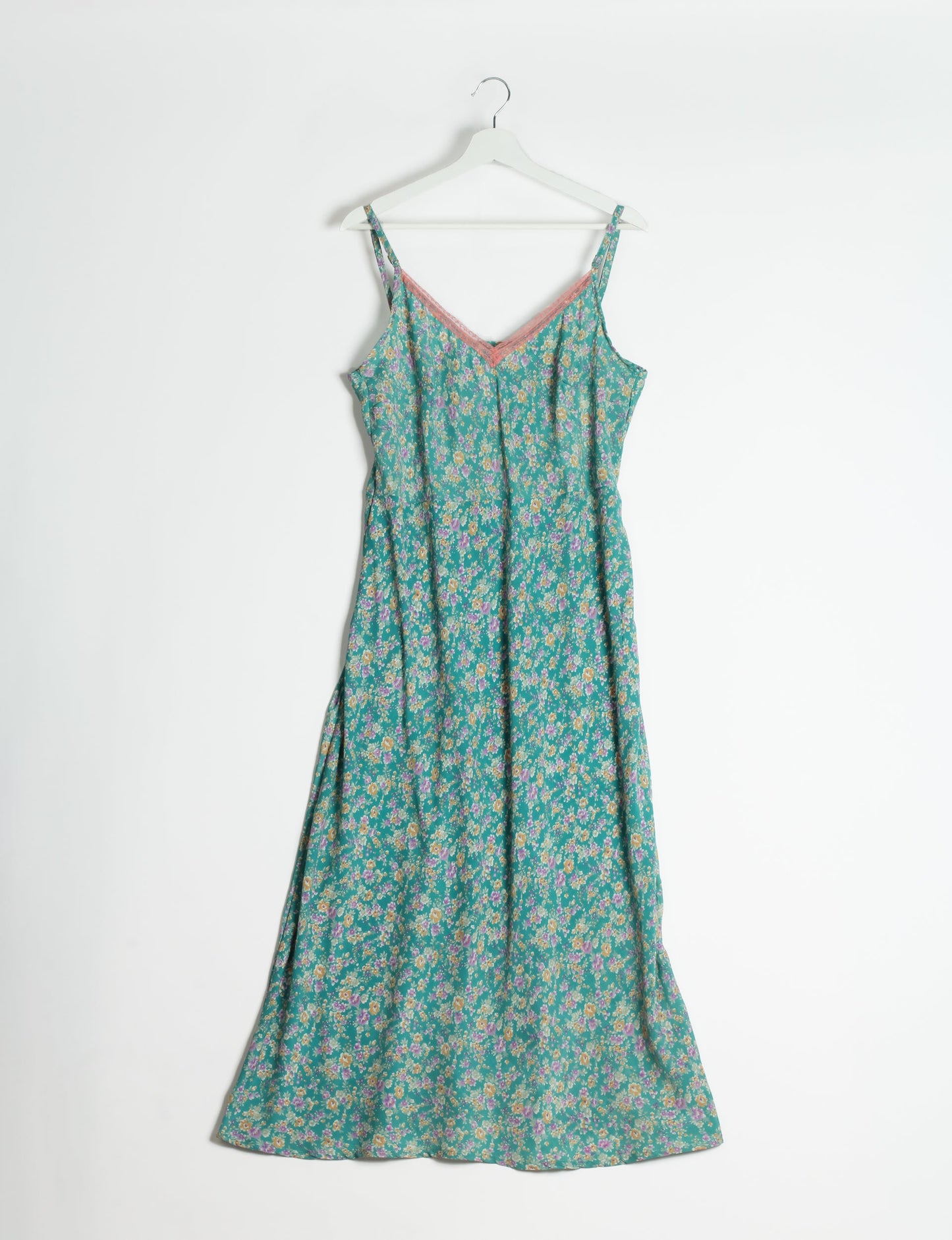 Spaghetti strap dress made from sustainable materials, embodying ethical fashion principles. Ideal for eco-friendly travelers seeking laid-back style.