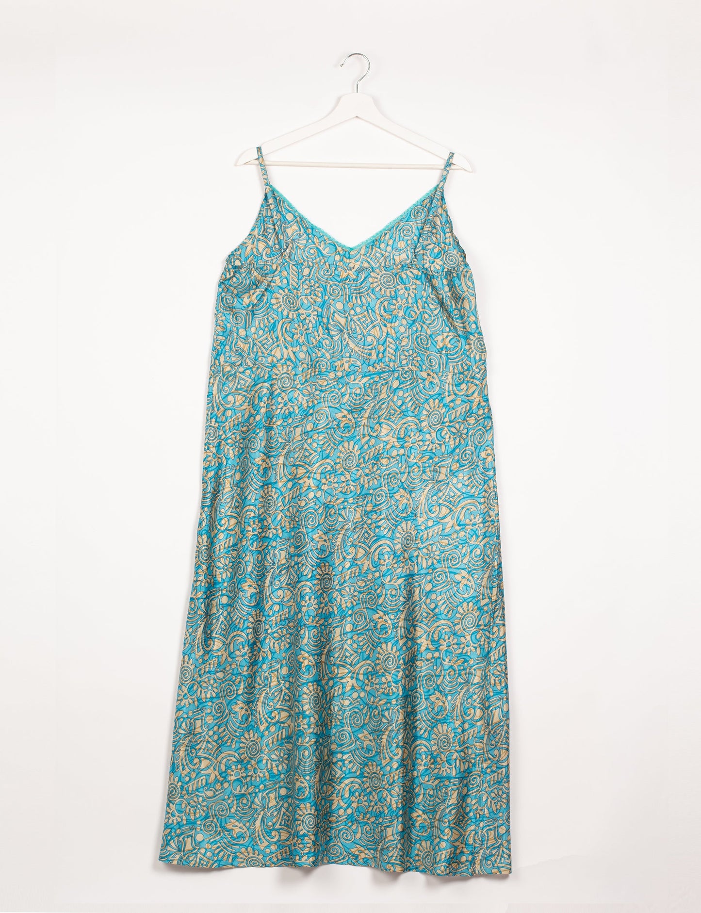 Spaghetti strap dress made from sustainable materials, embodying ethical fashion principles. Ideal for eco-friendly travelers seeking laid-back style.