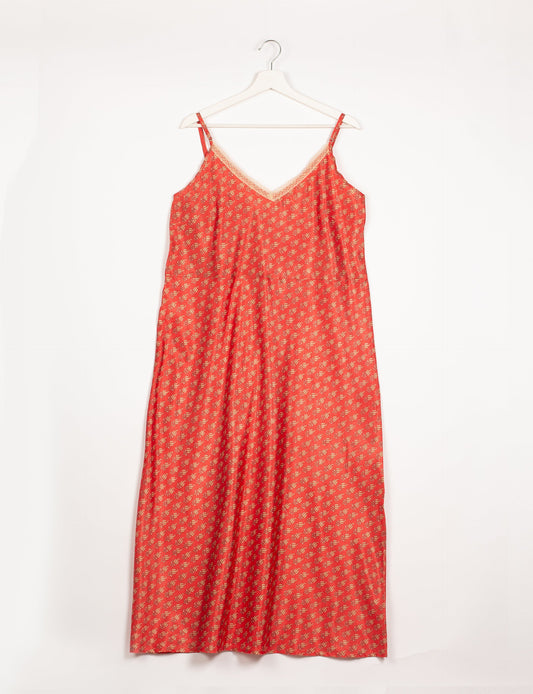 Spaghetti strap dress made from sustainable materials, embodying ethical fashion principles. Ideal for eco-friendly travelers seeking laid-back style.