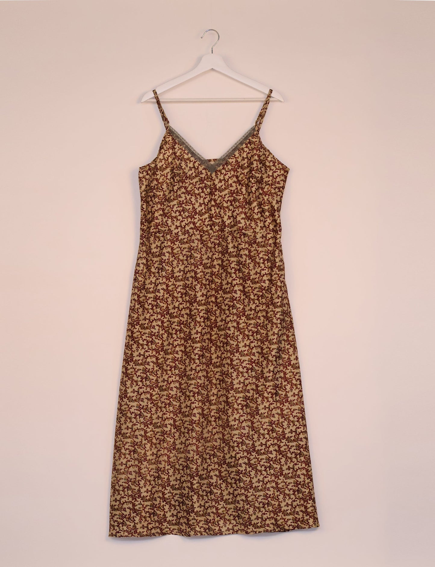 Spaghetti strap dress made from sustainable materials, embodying ethical fashion principles. Ideal for eco-friendly travelers seeking laid-back style.