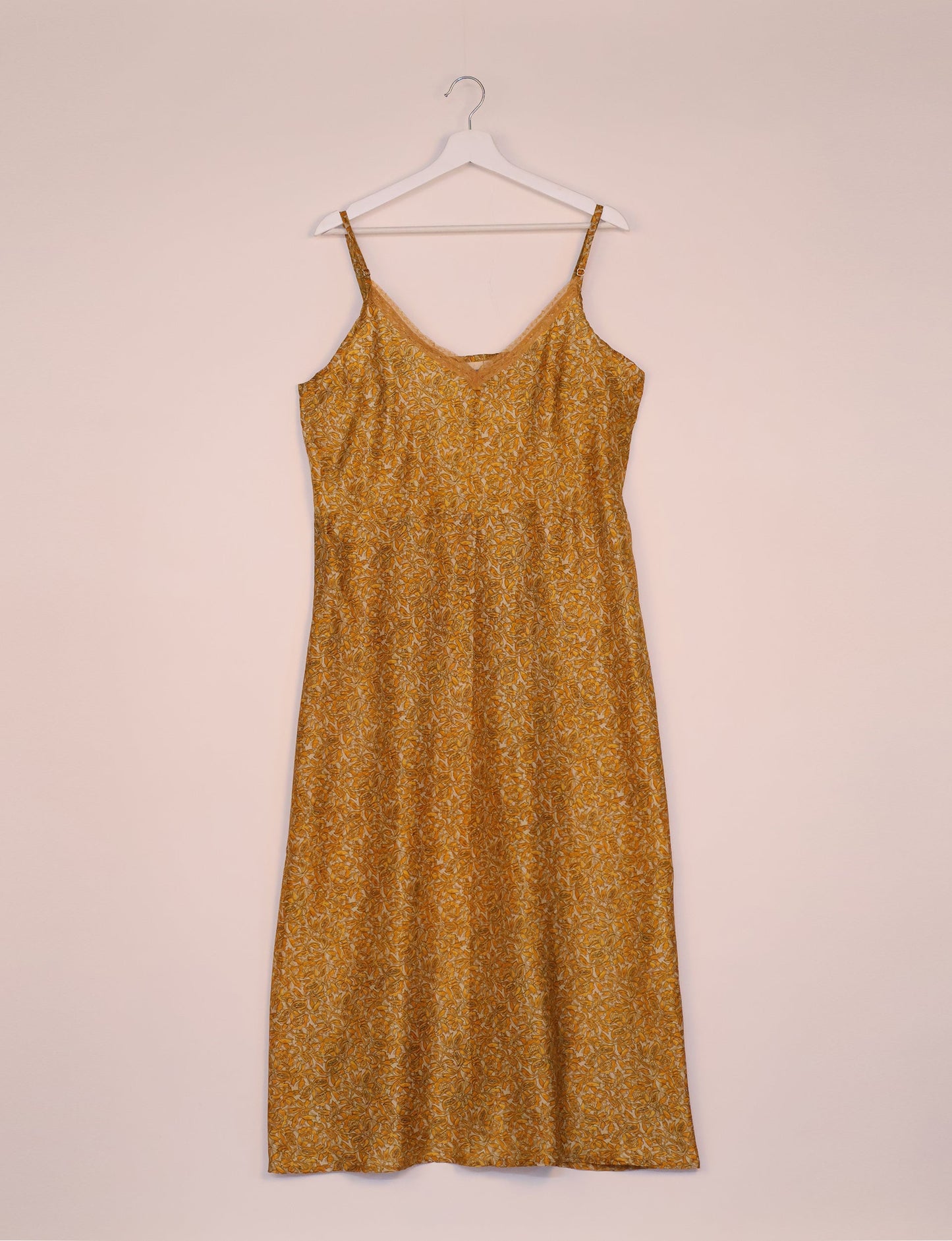 Spaghetti strap dress made from sustainable materials, embodying ethical fashion principles. Ideal for eco-friendly travelers seeking laid-back style.