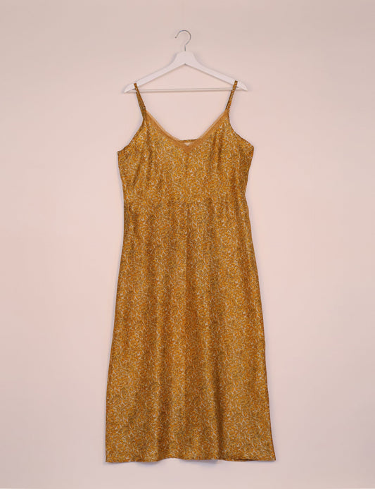 Spaghetti strap dress made from sustainable materials, embodying ethical fashion principles. Ideal for eco-friendly travelers seeking laid-back style.