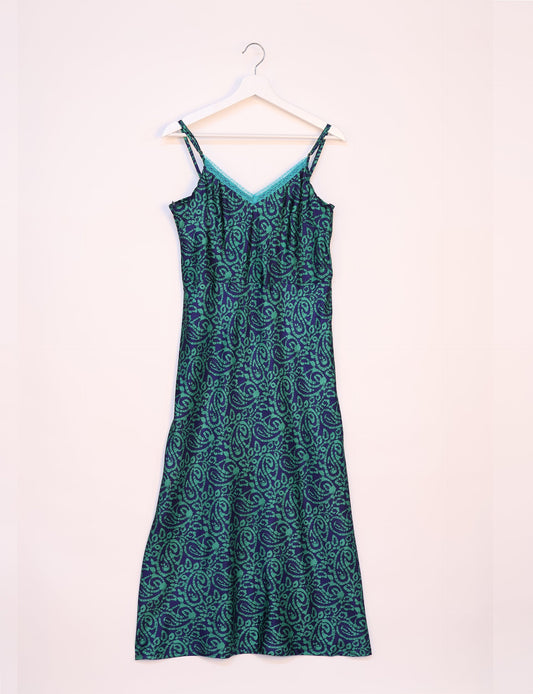 Spaghetti strap dress made from sustainable materials, embodying ethical fashion principles. Ideal for eco-friendly travelers seeking laid-back style.