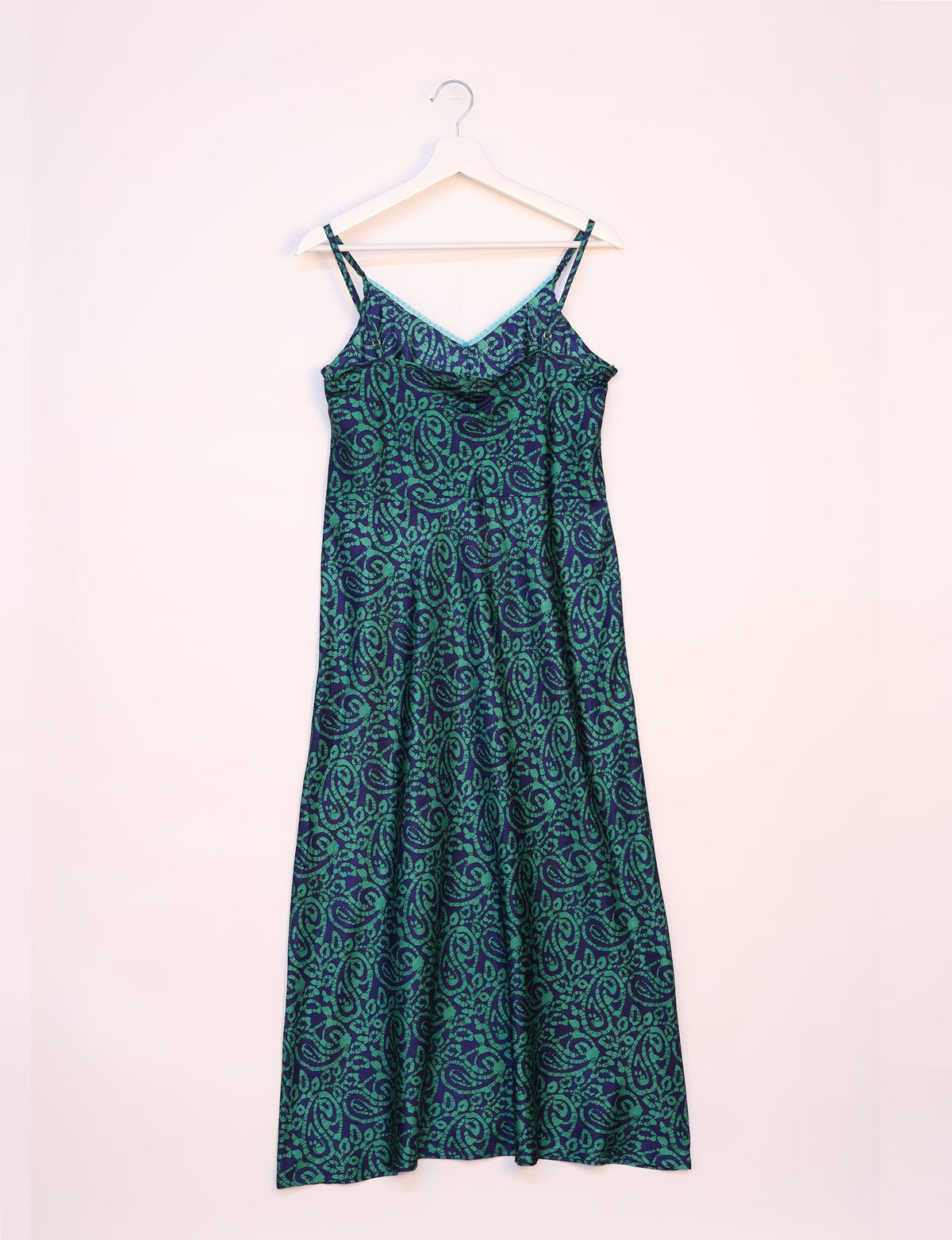 Spaghetti strap dress made from sustainable materials, embodying ethical fashion principles. Ideal for eco-friendly travelers seeking laid-back style.