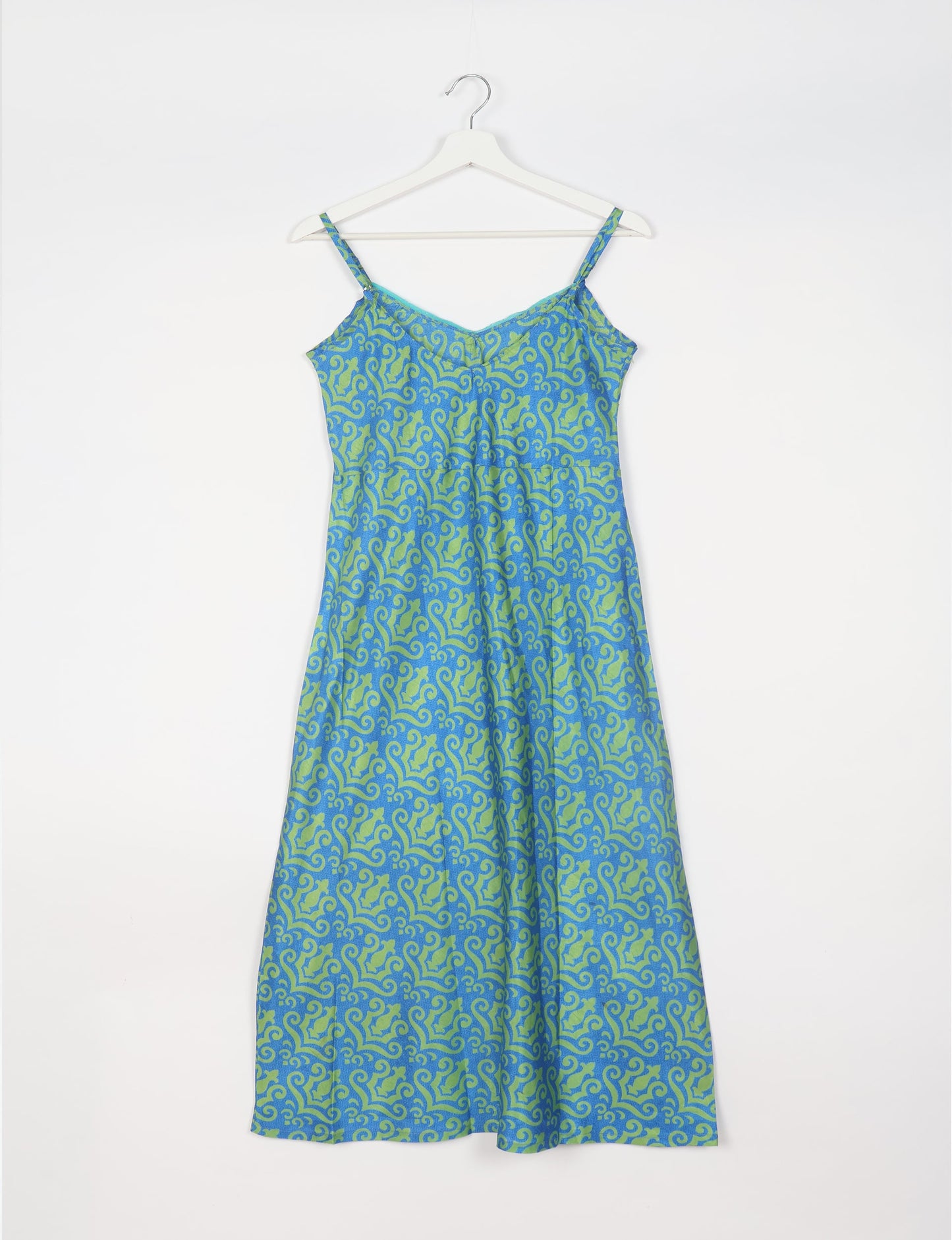 Spaghetti strap dress made from sustainable materials, embodying ethical fashion principles. Ideal for eco-friendly travelers seeking laid-back style.