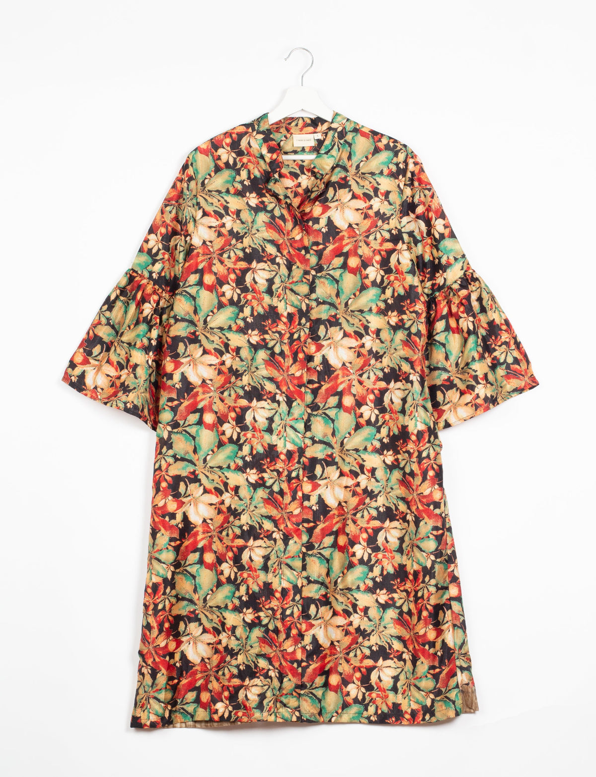 Black floral bell sleeve coat with green and red leaves, shown flat on hanger