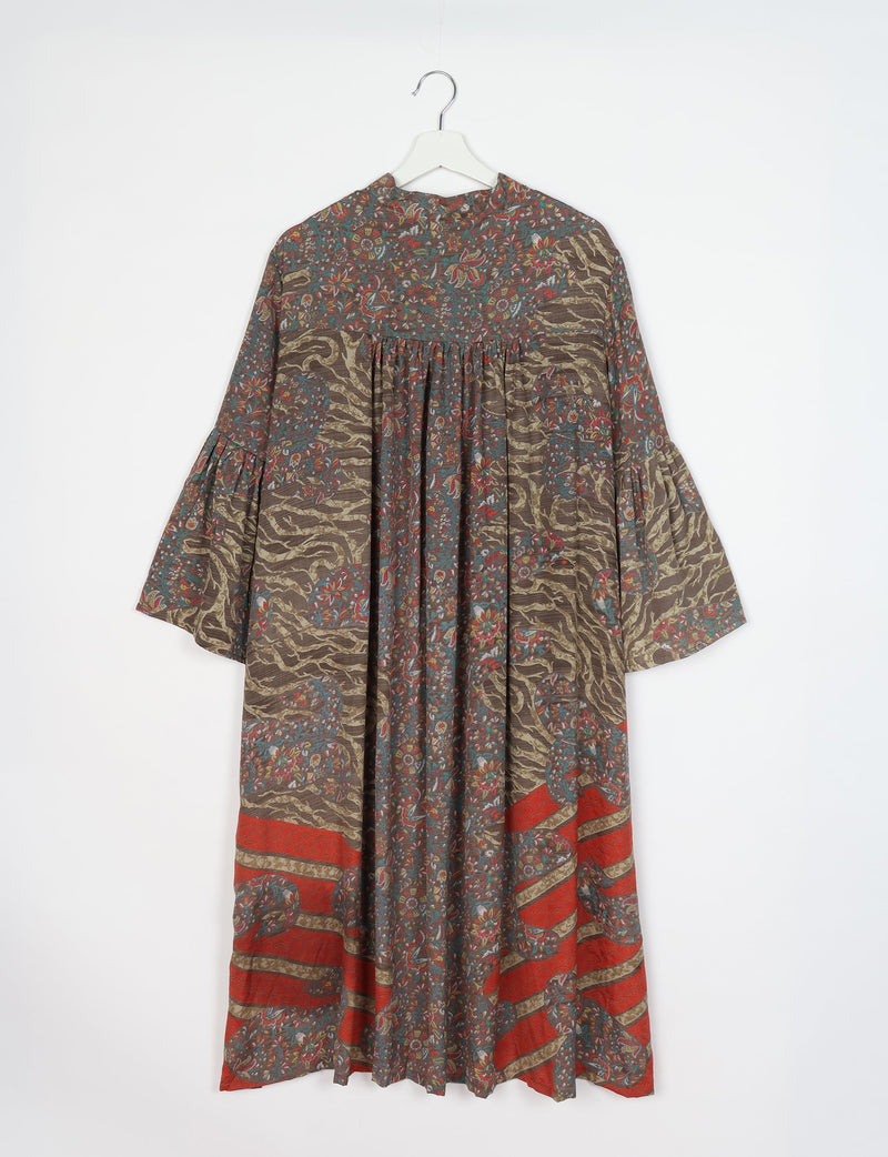 Brown tropical patterned bell sleeve coat with floral and abstract designs, hanging on white hanger, front view