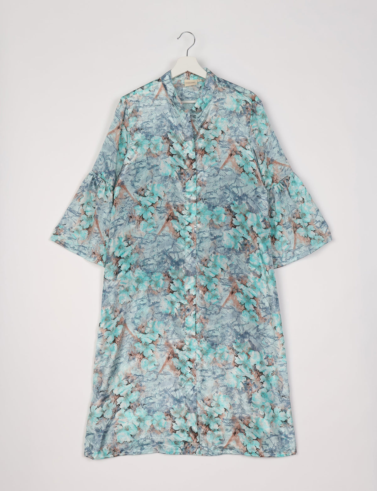 Blue floral bell sleeve coat with button front, standing collar, and loose fit, hanging on white hanger against white background