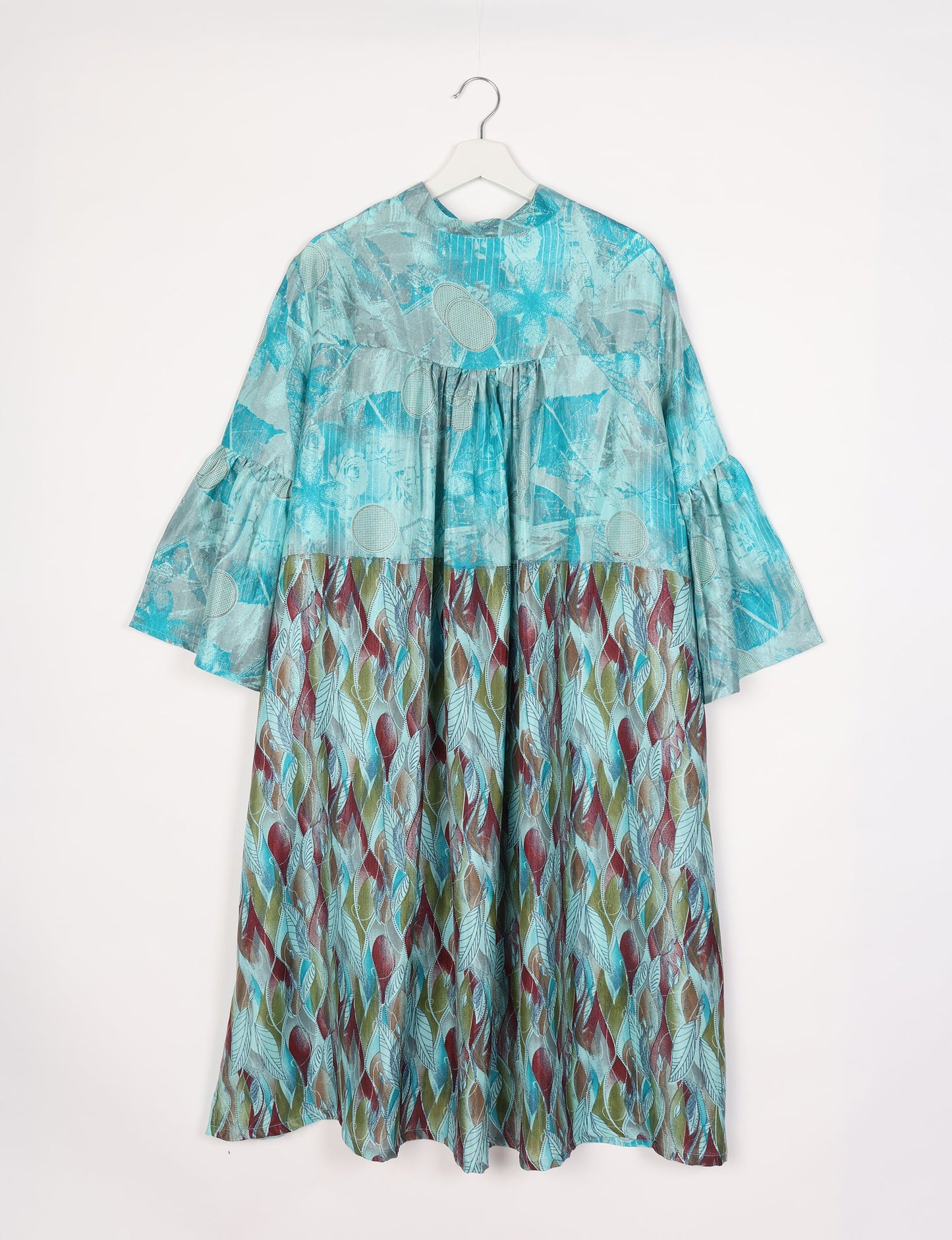 Discover ethical elegance with our Bell Sleeve Coat, handcrafted by Indian artisans from recycled materials. This sustainable fashion piece is a statement in eco-friendly clothing, combining style and consciousness effortlessly.