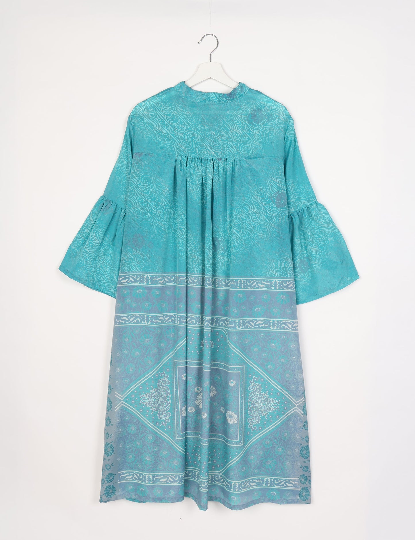 Discover ethical elegance with our Bell Sleeve Coat, handcrafted by Indian artisans from recycled materials. This sustainable fashion piece is a statement in eco-friendly clothing, combining style and consciousness effortlessly.