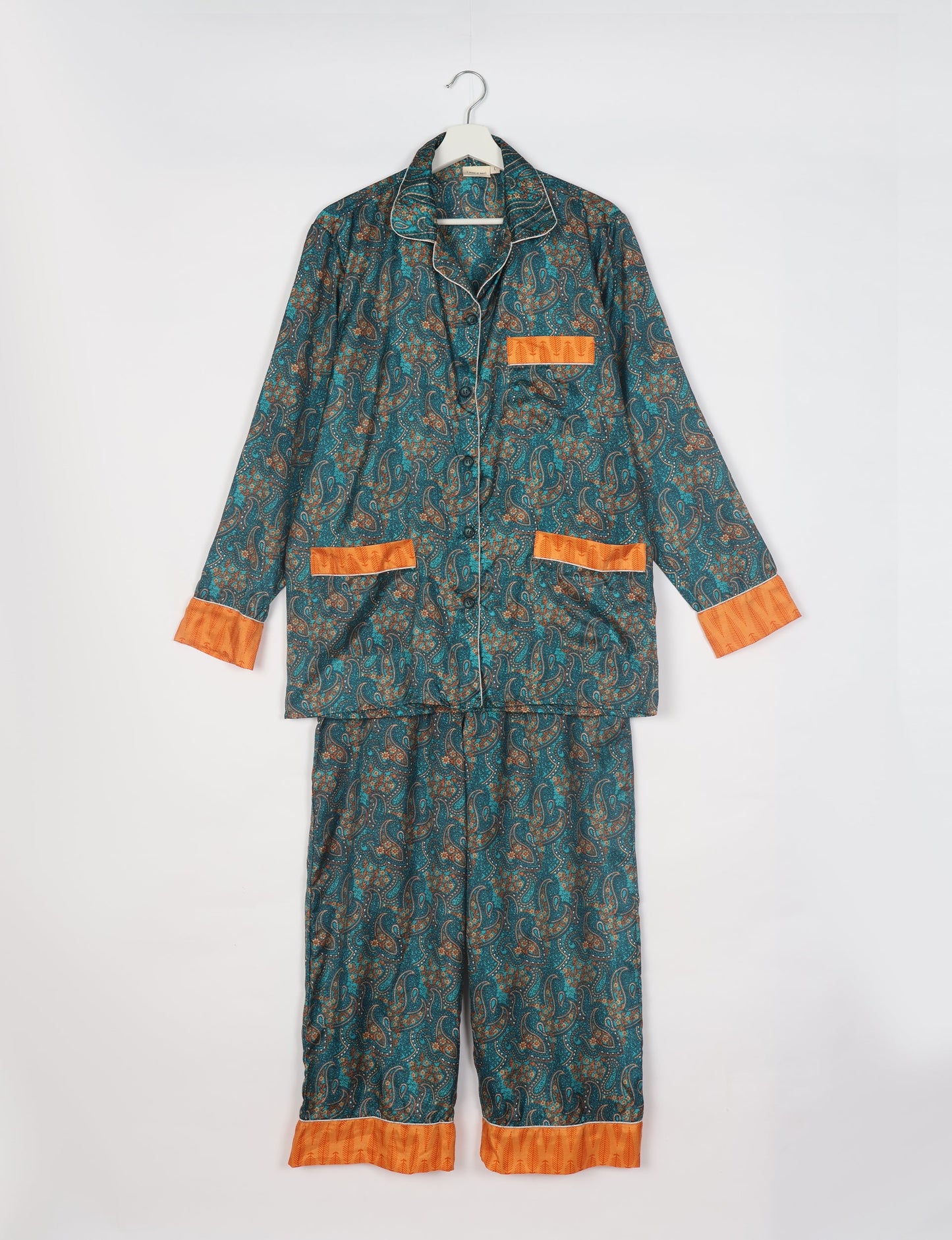 Choose sustainable sleepwear with our PJ SET – perfect for conscious living. From chilling to entertaining, these day-to-night pajamas feature an ethically crafted long-sleeve button-down and elastic-waist pants. Elevate your sleepwear with eco-friendly elegance.