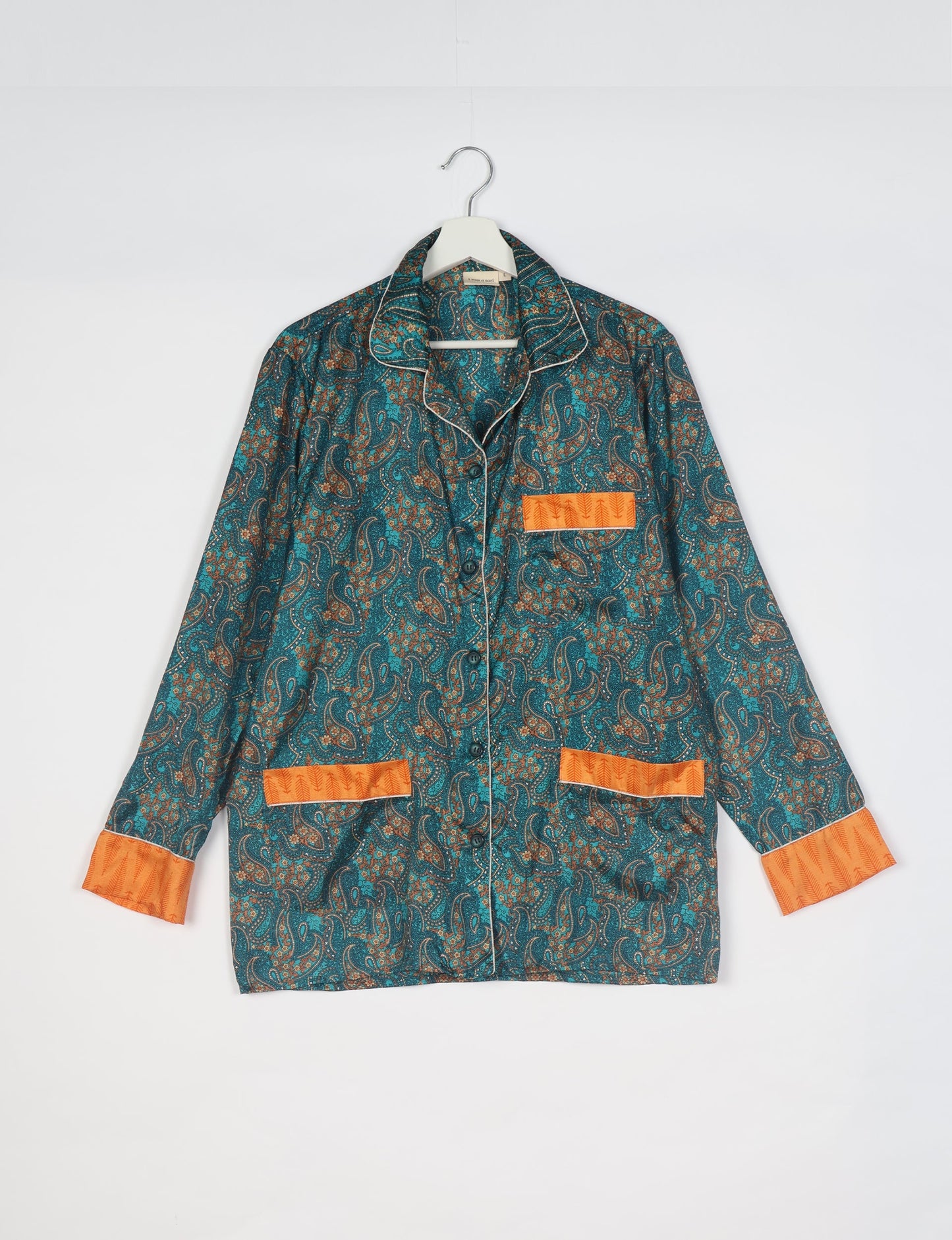 Choose sustainable sleepwear with our PJ SET – perfect for conscious living. From chilling to entertaining, these day-to-night pajamas feature an ethically crafted long-sleeve button-down and elastic-waist pants. Elevate your sleepwear with eco-friendly elegance.