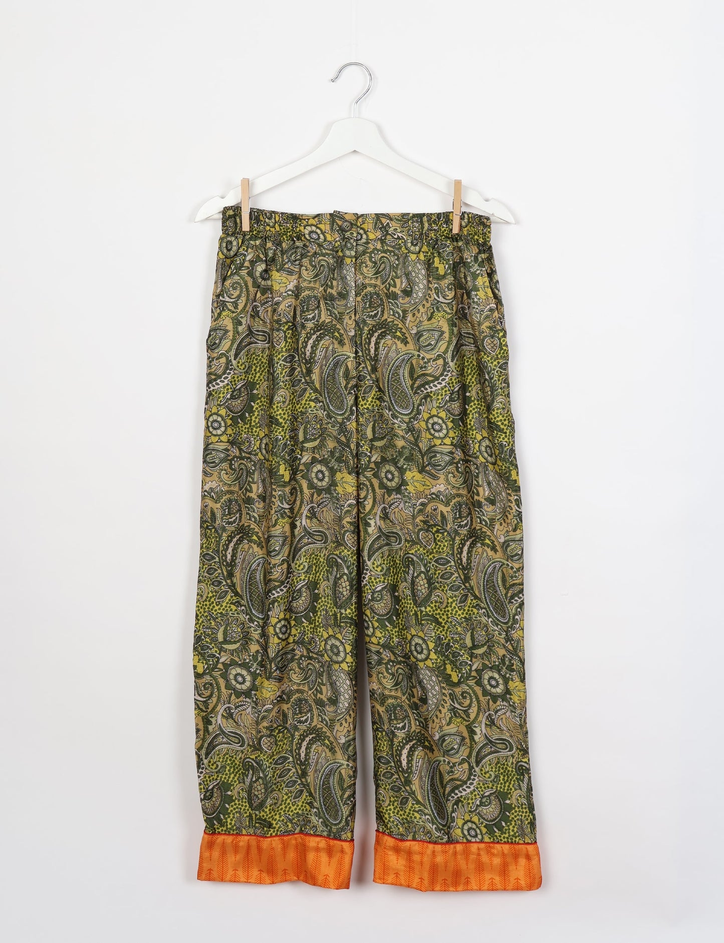 Chic long-sleeve pajama set made from recycled materials, representing eco friendly products, repurposed clothing, and zero waste clothing in green fashion.