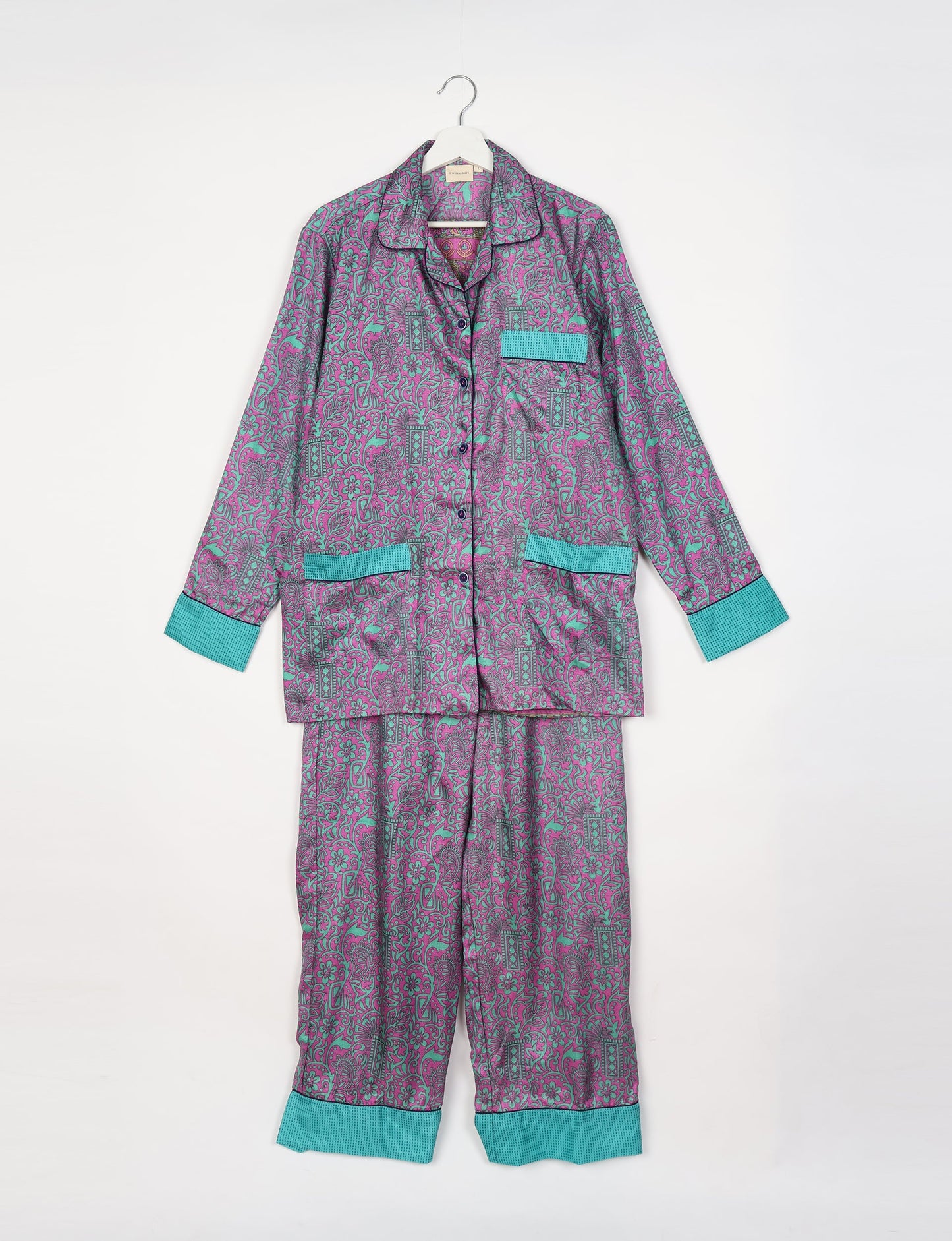 Chic long-sleeve pajama set made from recycled materials, representing eco friendly products, repurposed clothing, and zero waste clothing in green fashion.