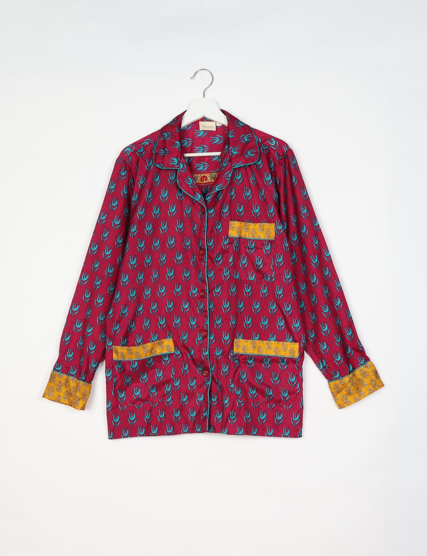 Chic long-sleeve pajama set made from recycled materials, representing eco friendly products, repurposed clothing, and zero waste clothing in green fashion.