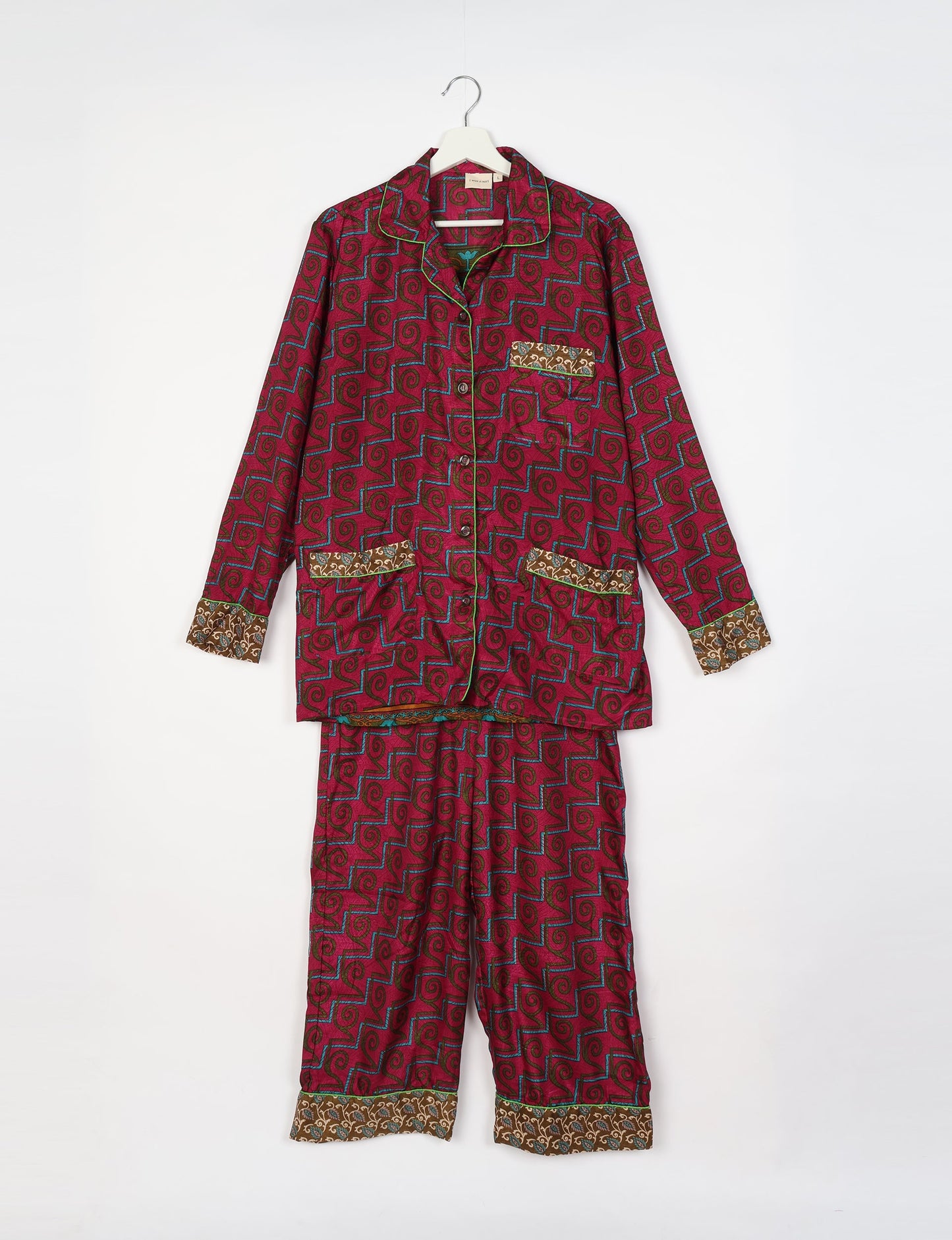 Chic long-sleeve pajama set made from recycled materials, representing eco friendly products, repurposed clothing, and zero waste clothing in green fashion.