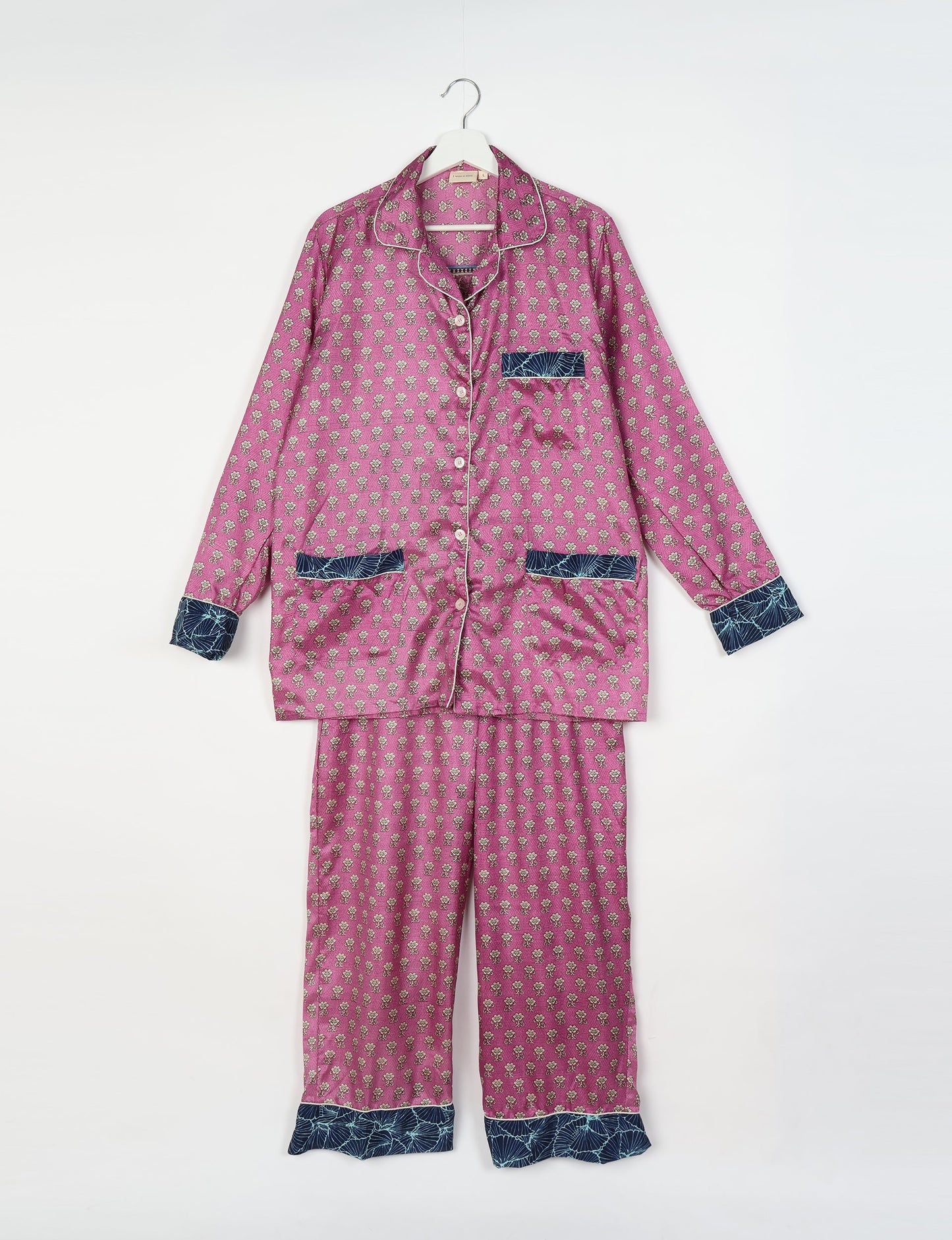 Chic long-sleeve pajama set made from recycled materials, representing eco friendly products, repurposed clothing, and zero waste clothing in green fashion.