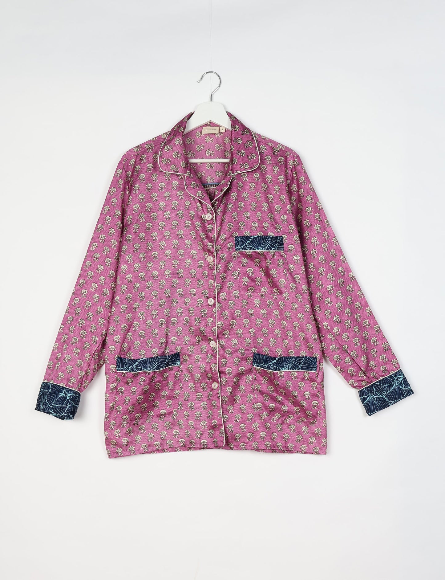 Chic long-sleeve pajama set made from recycled materials, representing eco friendly products, repurposed clothing, and zero waste clothing in green fashion.