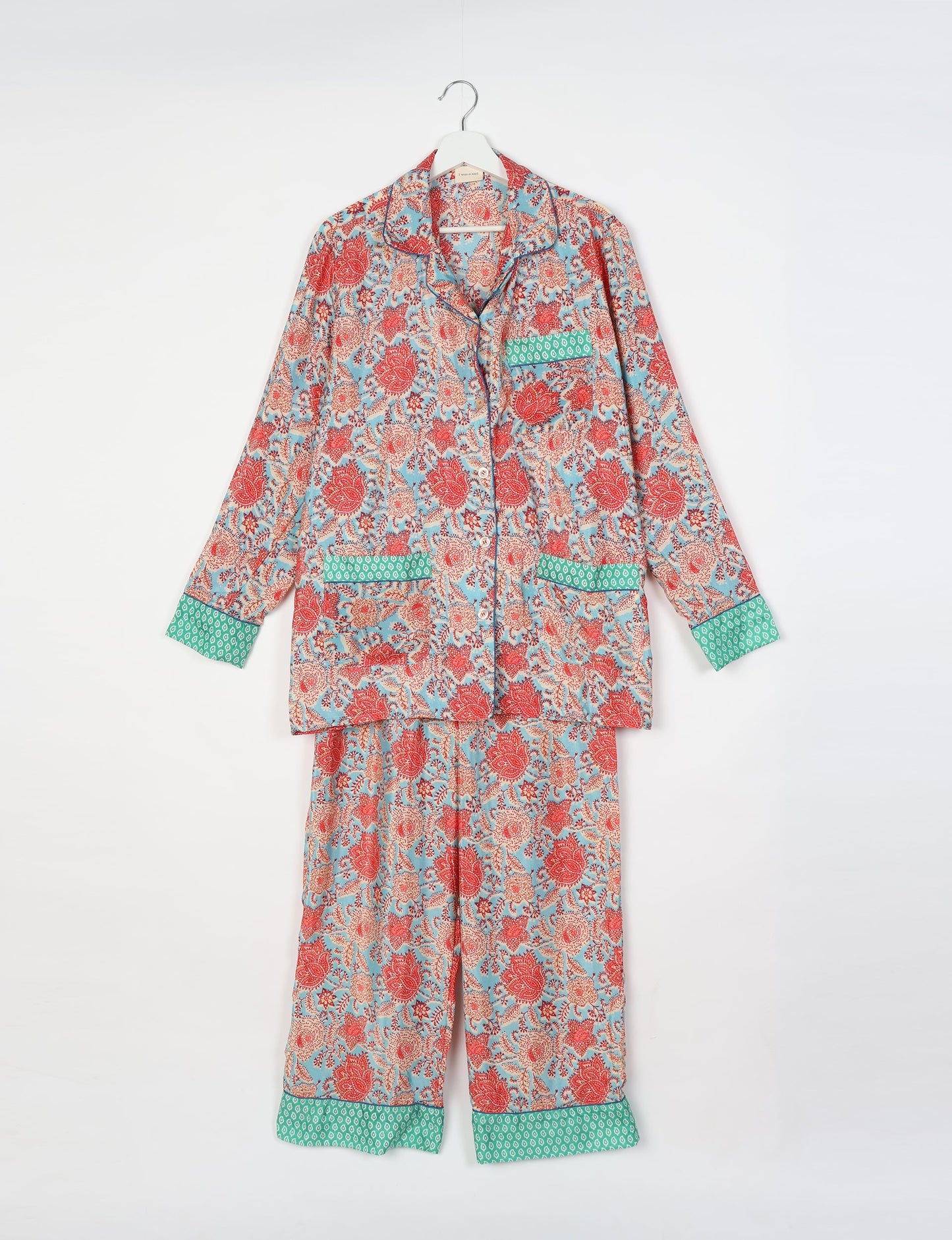 Chic long-sleeve pajama set made from recycled materials, representing eco friendly products, repurposed clothing, and zero waste clothing in green fashion.