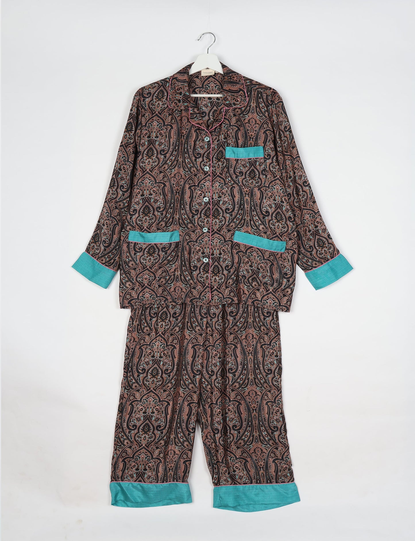 Chic long-sleeve pajama set made from recycled materials, representing eco friendly products, repurposed clothing, and zero waste clothing in green fashion.