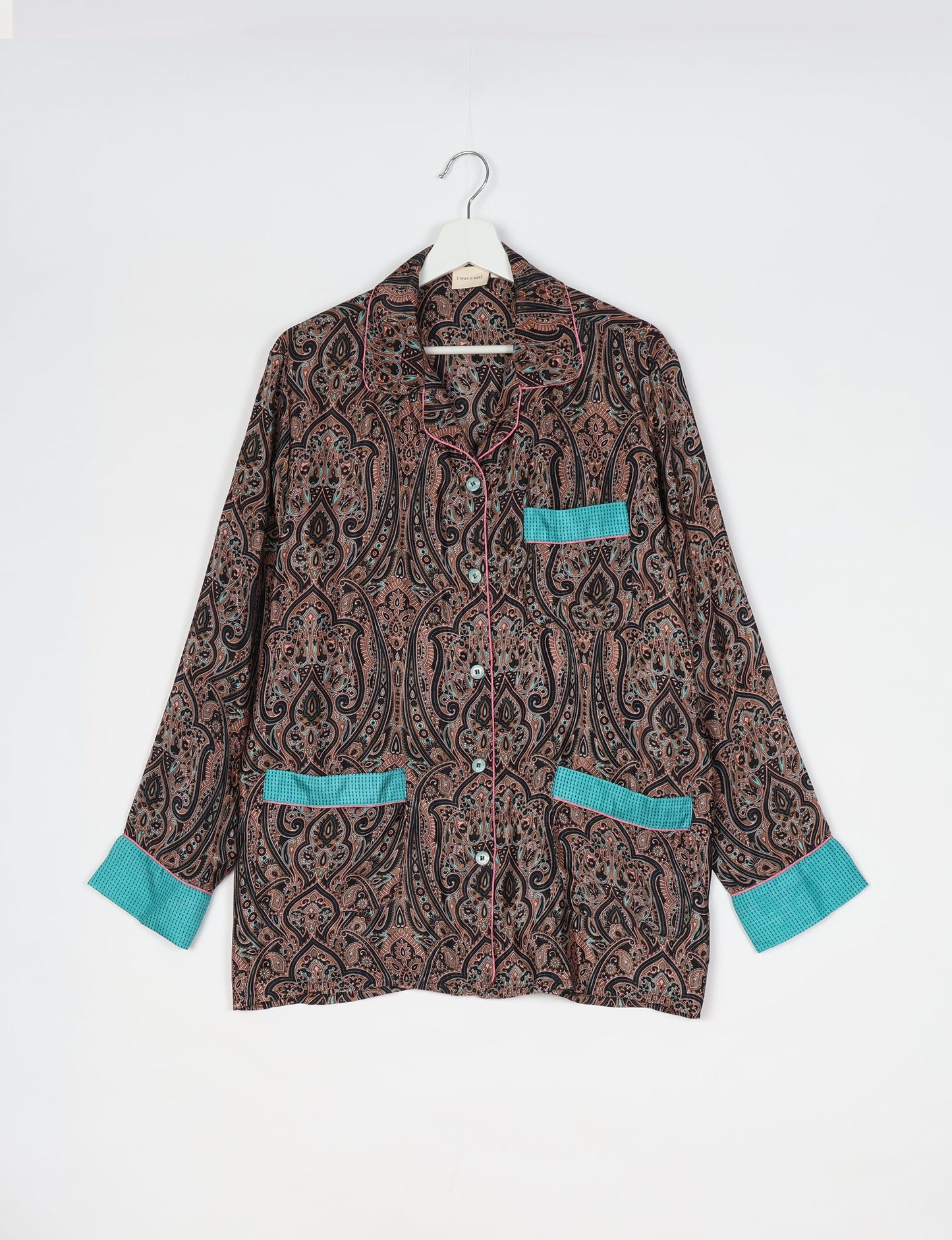 Chic long-sleeve pajama set made from recycled materials, representing eco friendly products, repurposed clothing, and zero waste clothing in green fashion.